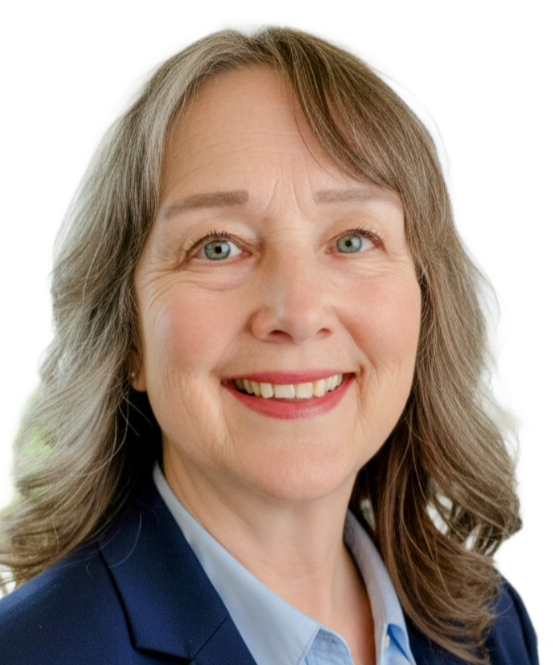 Portrait of a smiling middle-aged woman with blonde hair, blue eyes, and fair skin, wearing a navy blazer and light blue shirt.
