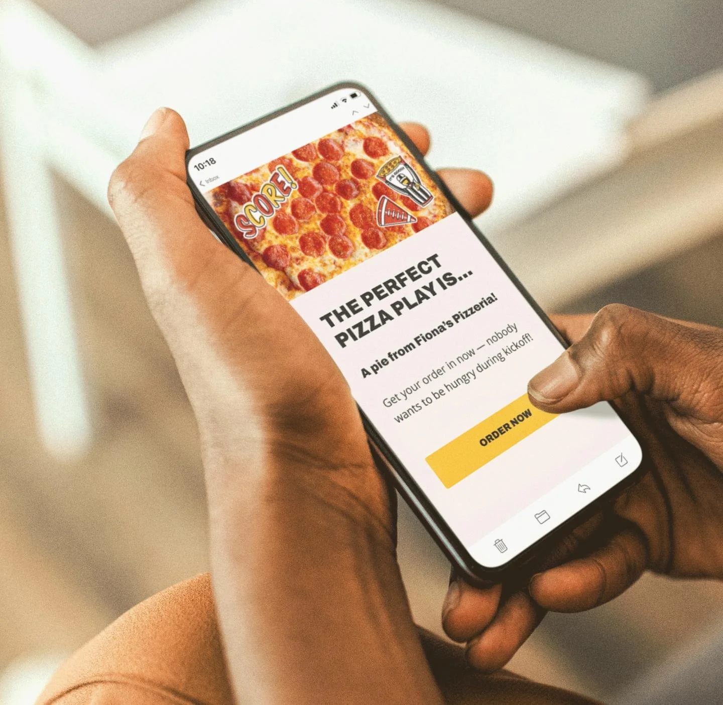 Woman holding mobile phone with Slice empowered email displayed on screen