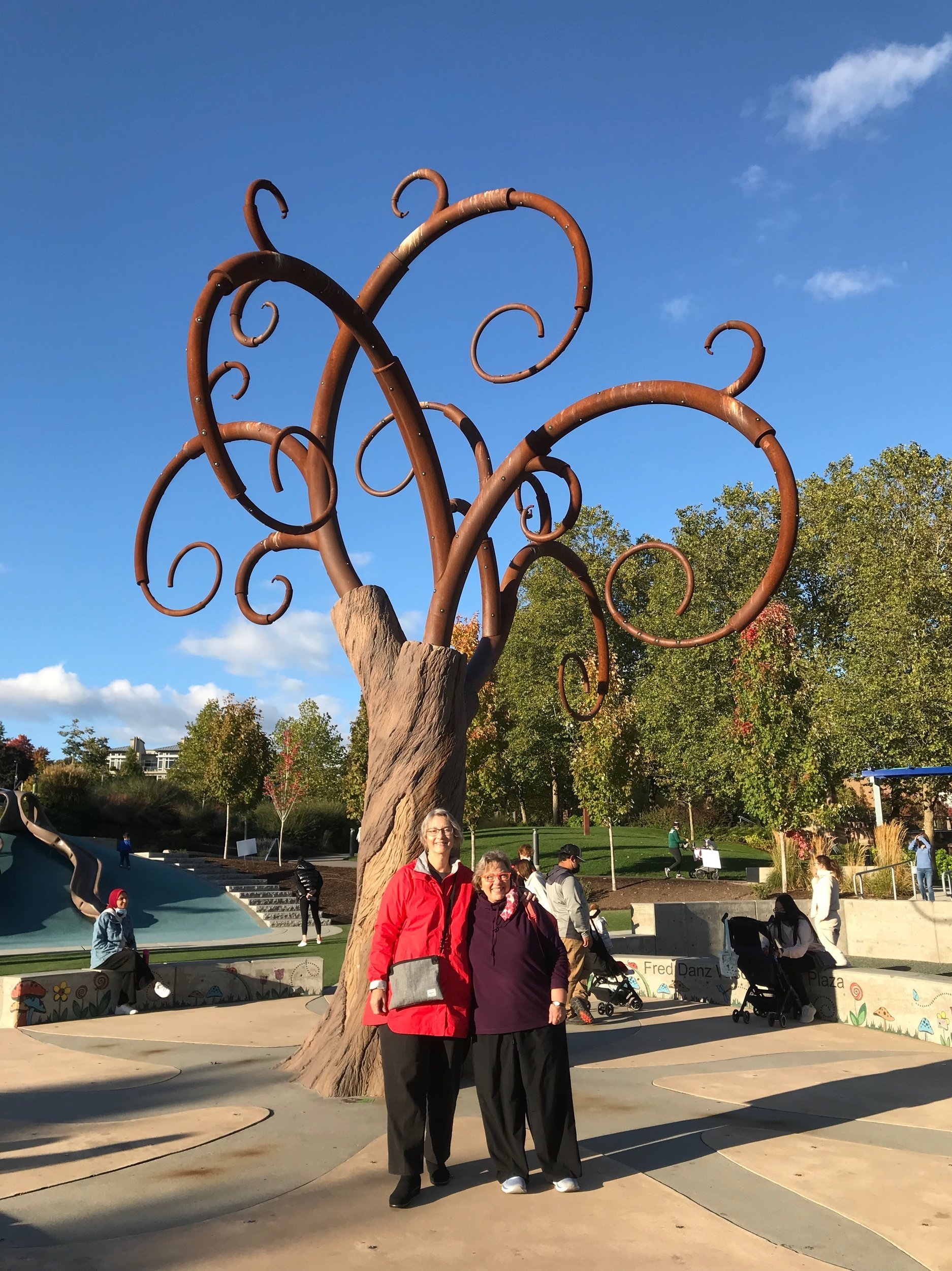 Standing in front of the children's area in the Downtown Bellevue Park.