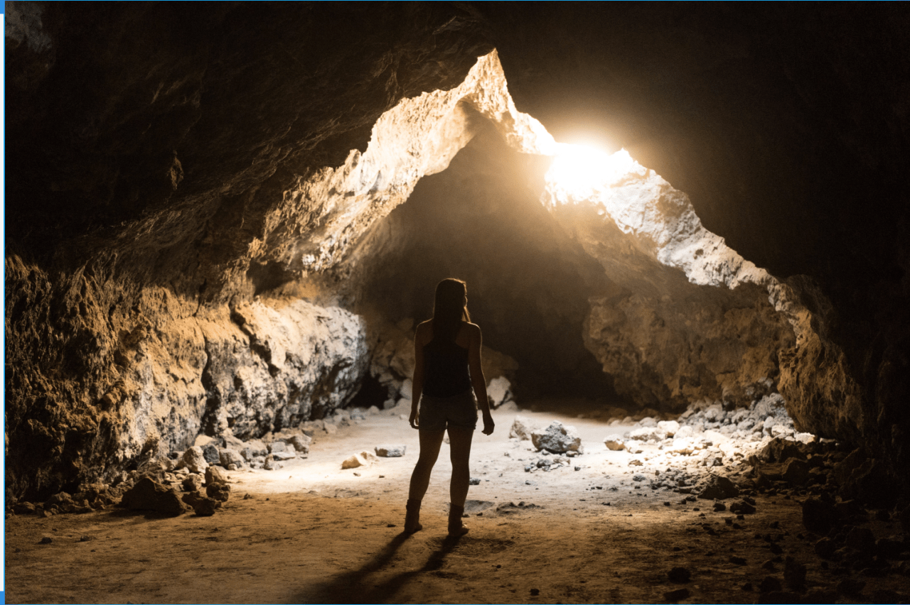 Bright natural dining room nook with vases plates and fruits on the table.