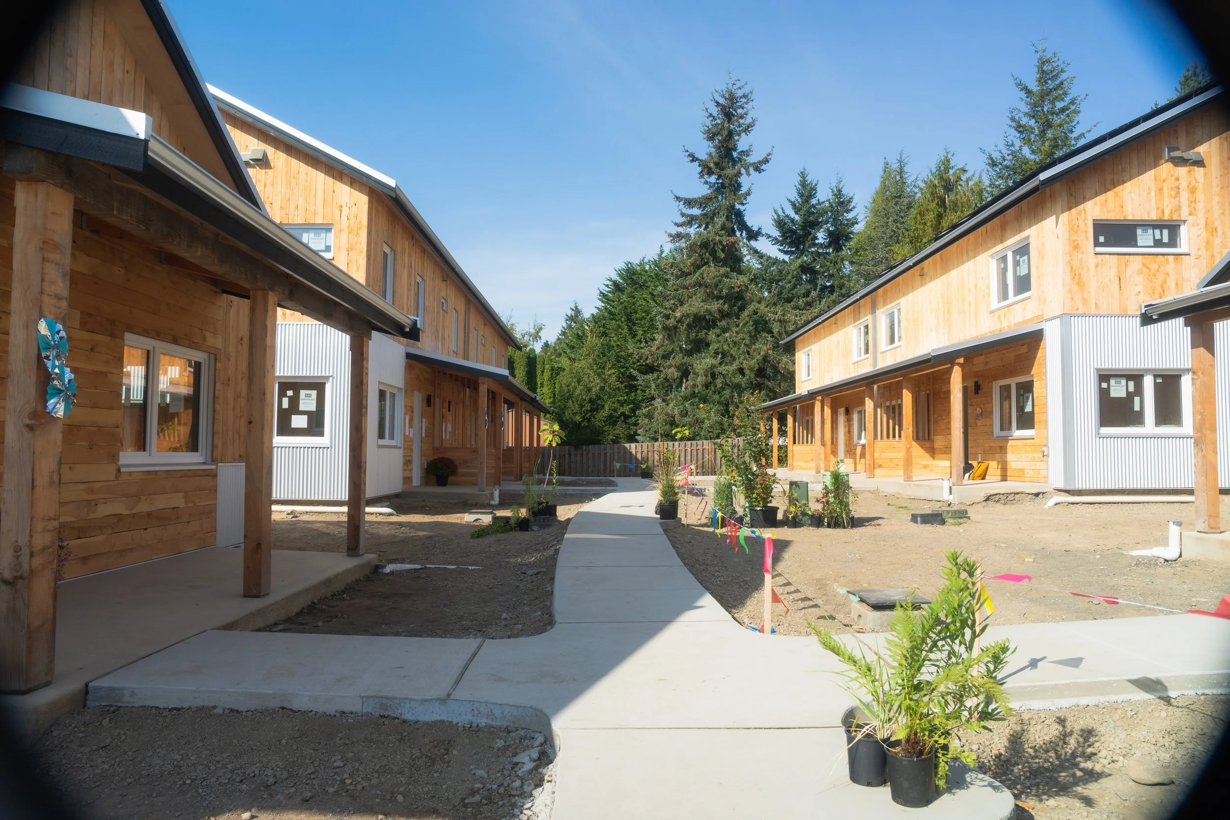 Ground view of central path through LaFreniere Court's western-most development (eight townhomes and two ADA single family units).