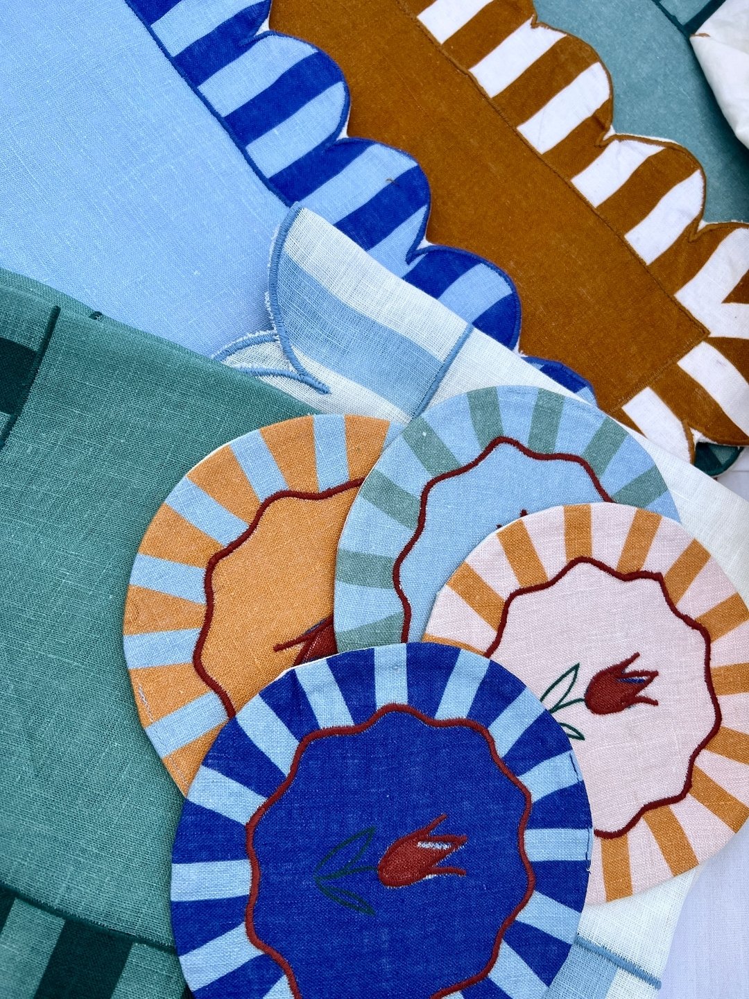 Placemats, napkins and coasters. Get ready for your summer entertaining. Scalloped edges, hand embroidery, pretty color palette -- these pieces will be the talk of the town. 

#twowebster #shopthecape #shoposterville #shopmelange #homedecor #homesoha