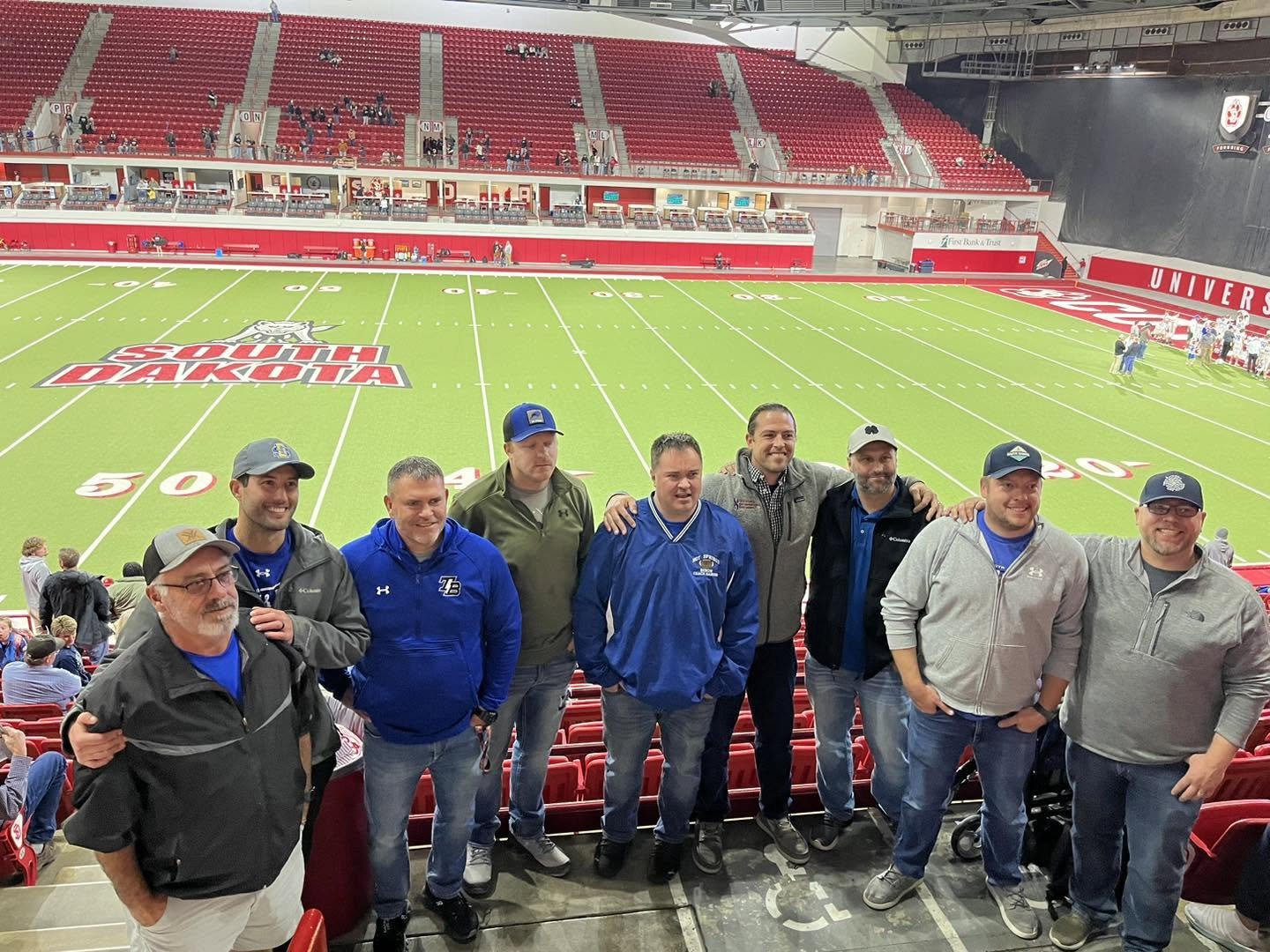 Members of the 2003 Football Team Celebrating State Title