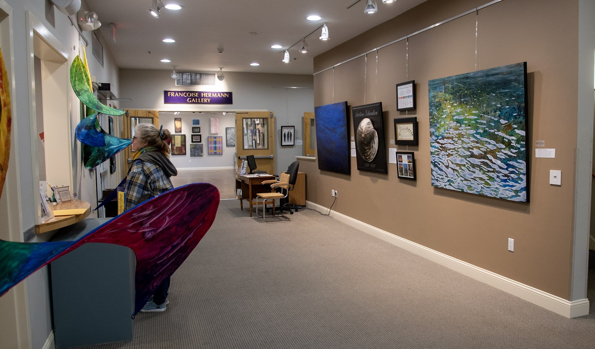  Several works hung in the gallery, including "Marine Heatwaves" by Deb Ehrens, "Deep Ocean: Disintegration" by Heather E. Stivison, "Arctica Islandica" by Claire Marschak, and "Coastal Surface: Community" by Heather E. Stivison 