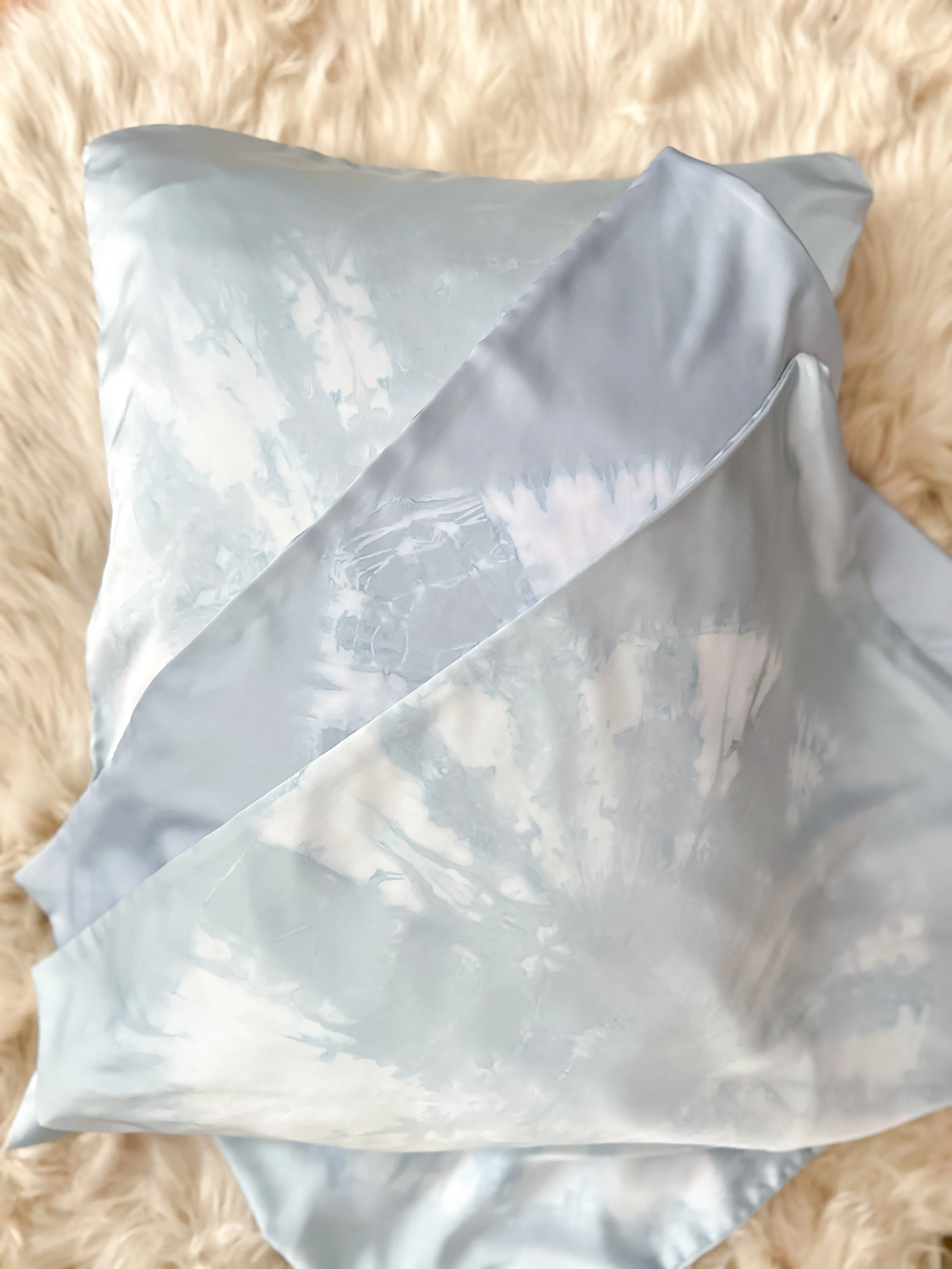 100% mulberry silk pillowcase, hand-tied, hand-dyed, standard size, hidden zipper. Beneficial for hair and skin health, breathable and hypoallergenic for better sleep. Small-batch made.
