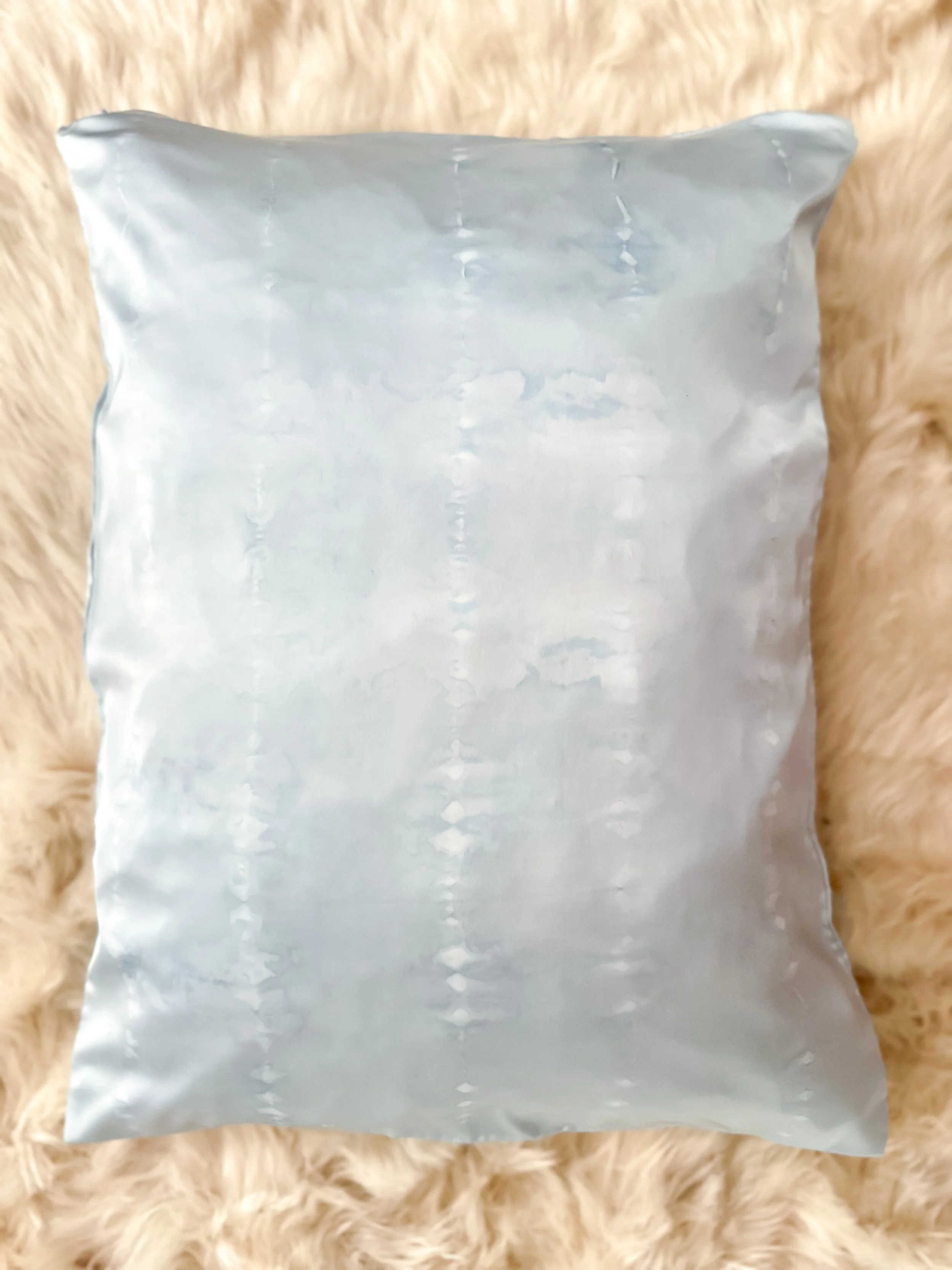 100% mulberry silk pillowcase, hand-tied, hand-dyed, standard size, hidden zipper. Beneficial for hair and skin health, breathable and hypoallergenic for better sleep. Small-batch made.