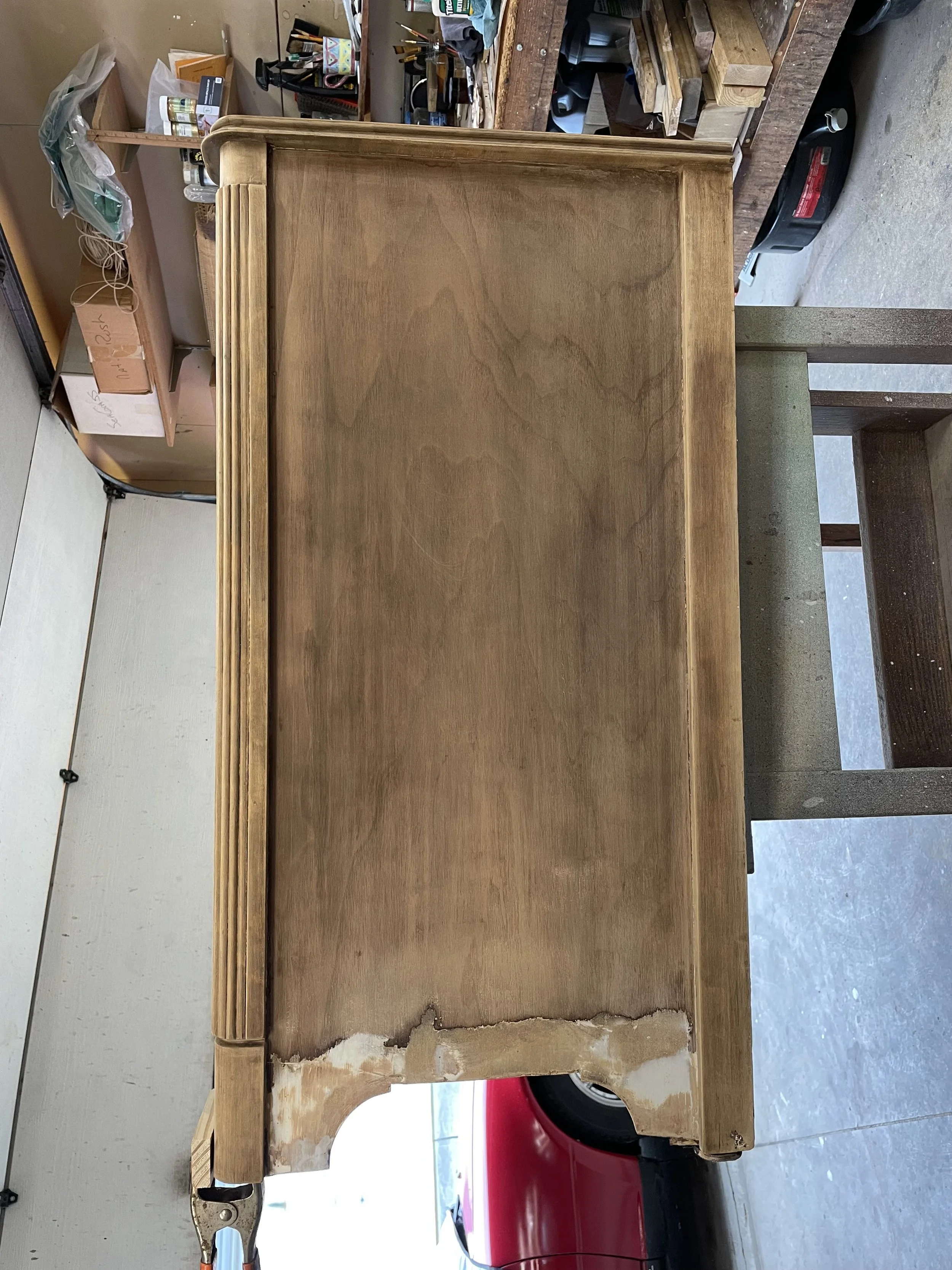 Side view of bar cabinet. Uncovered a patch to fix damage at the base