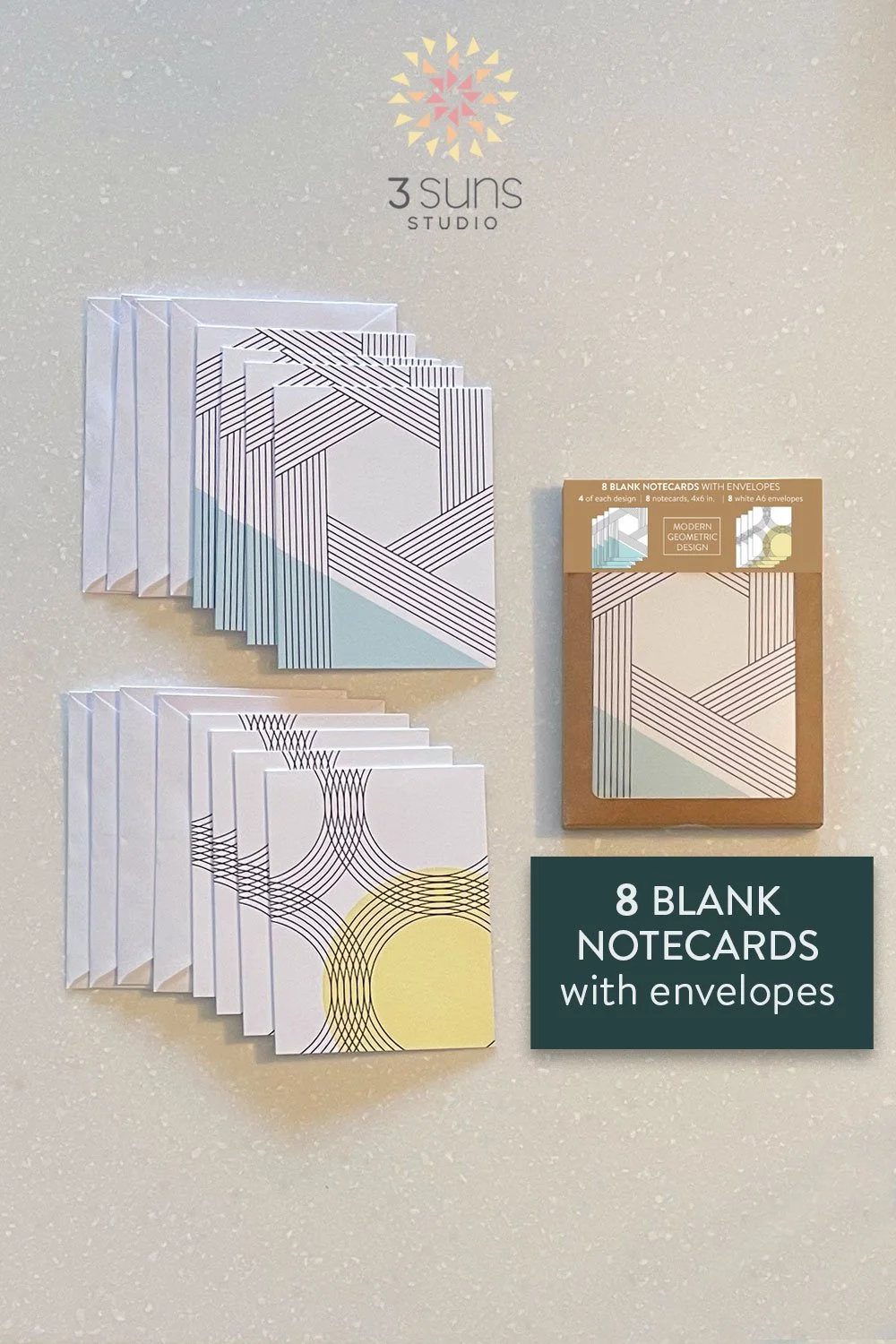 Set of 8 blank notecards, featuring 2 linear abstract designs. Includes 8 white envelopes and packaged in a brown Kraft box with a window.