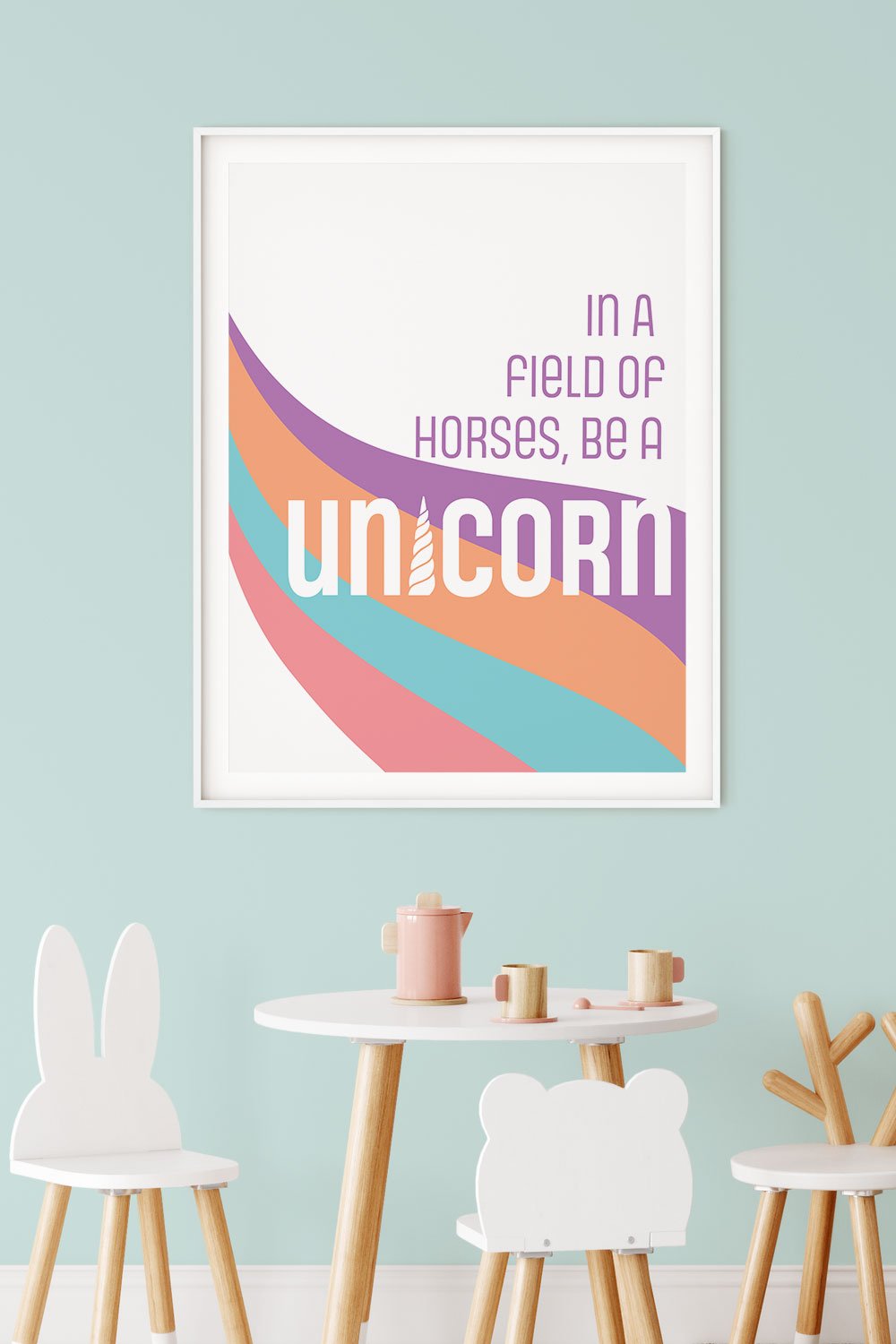 A clean and modern art print depicting the phrase “In a field of horses, be a unicorn”. Bold and bright color scheme, perfect for kids room or playroom. Frame not included.