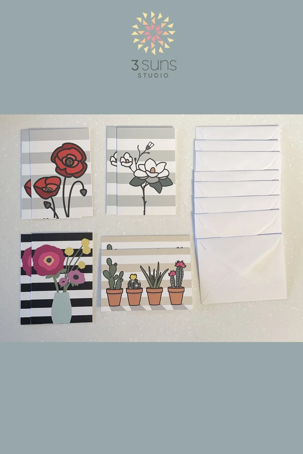 Set of 8 blank notecards, featuring 4 modern floral designs. Includes 8 white envelopes.