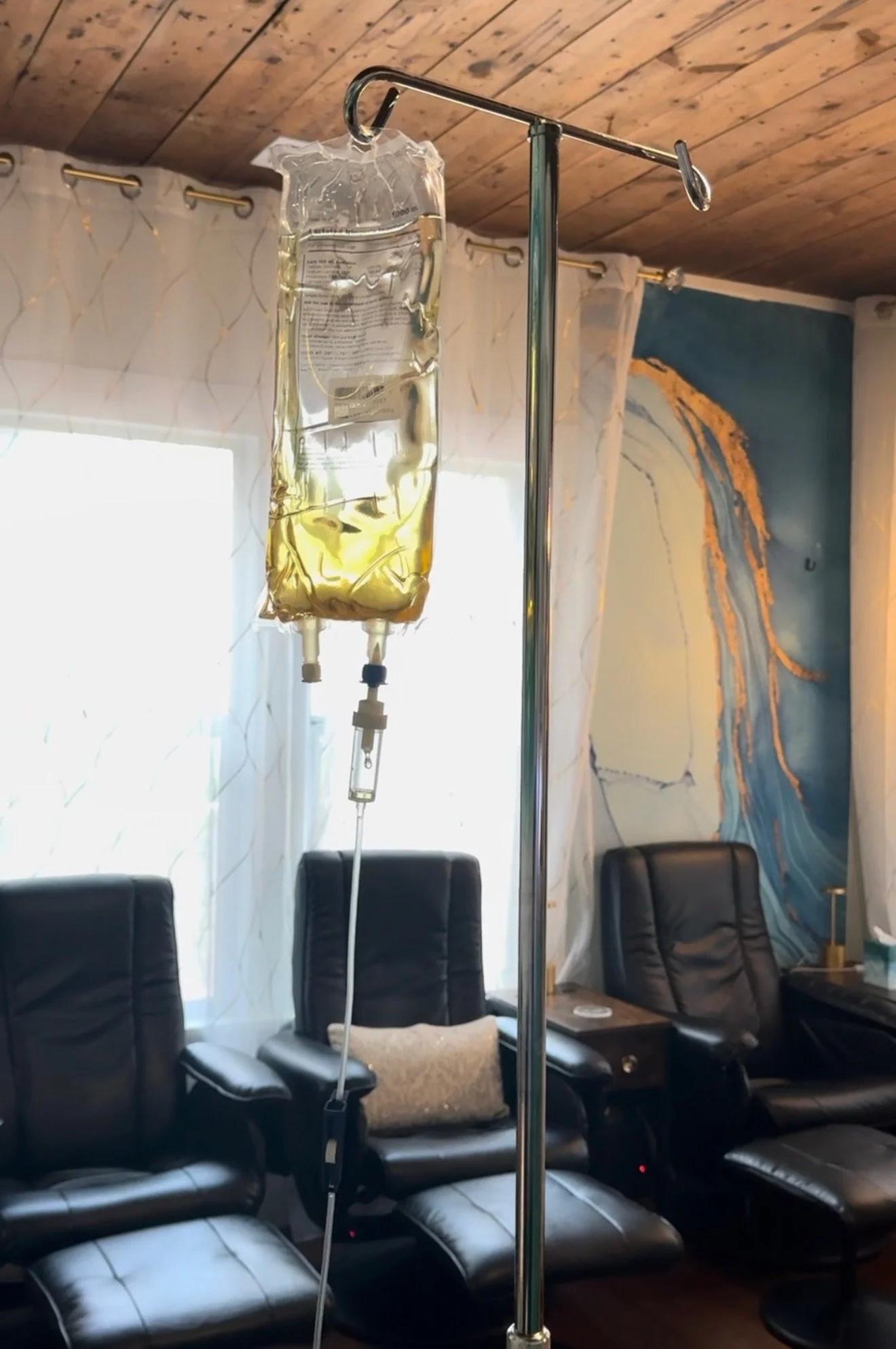 Hanging IV infusion vitamin drip in front of window at The Irenic Place in Aledo, TX