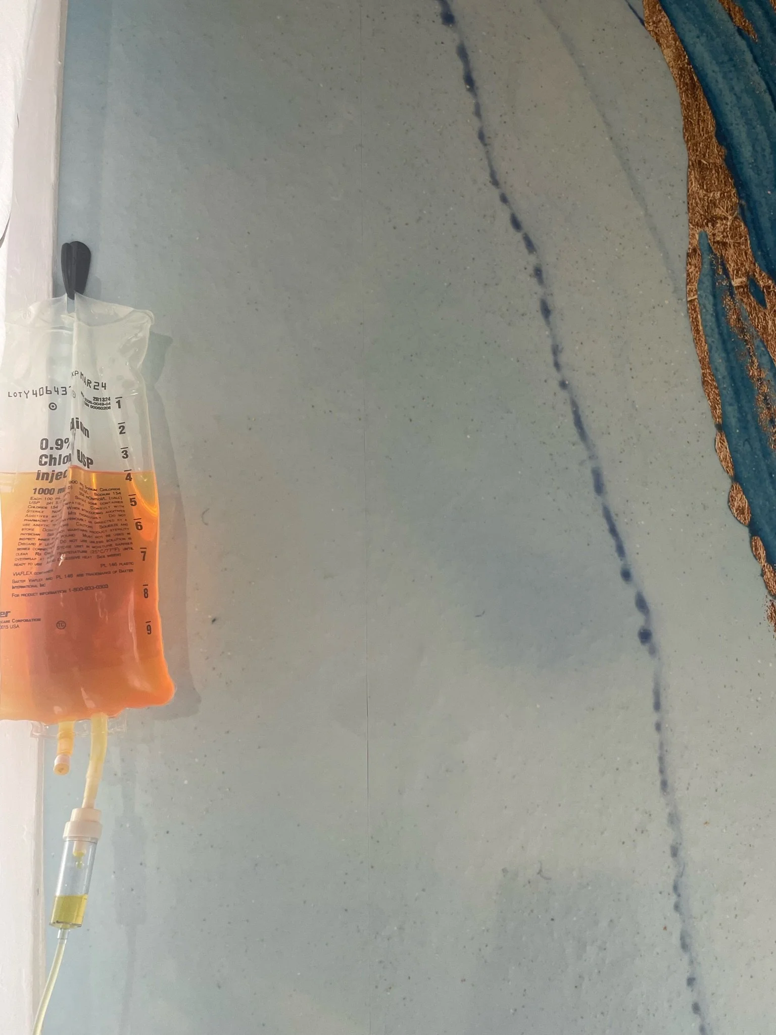 Mitochondria and energy support vitamin IV infusion bag hanging on the wall at The Irenic Place in Aledo, Texas