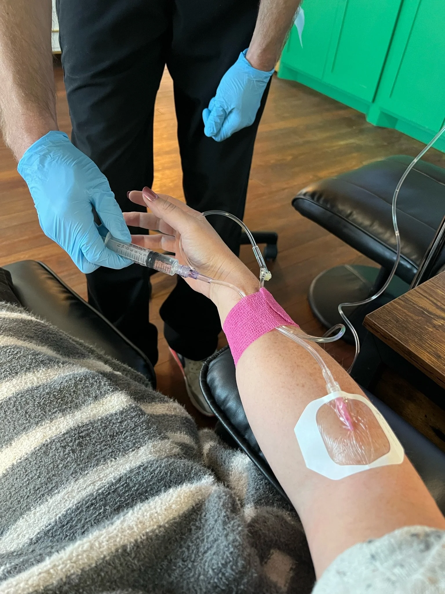 Vitamin IV infusion for woman to help with stress and busy schedule at The Irenic Place in Aledo, Texas in the Infuse Room