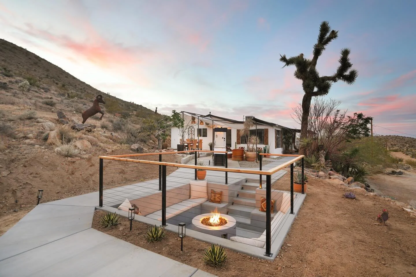 Absolutely loving this 2 bedroom, 2 bathroom short term rental near Joshua Tree National Park. From the in-ground fire pit and cozy seating area to the hot tub, scenic mountain trails, and thoughtfully designed interior - every detail makes this prop