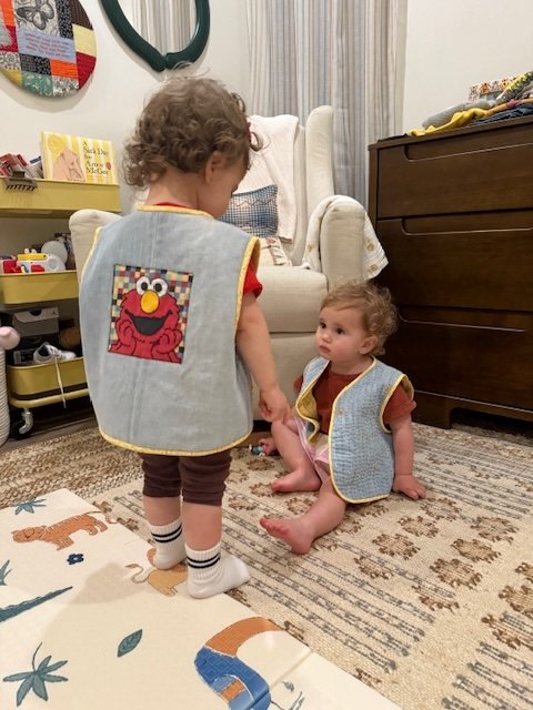 Custom toddler vests made from repurposed denim and hand stitched raw appliqué with fabric scraps.  SOLD