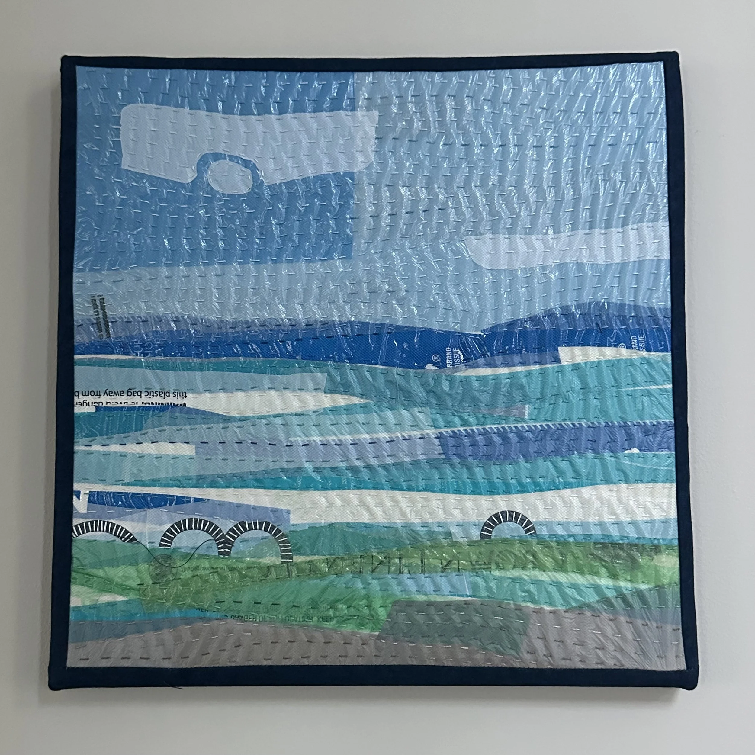 Seascape. Hand stitched plastic bags and packaging. Canvas wrapped. 12" x 12"