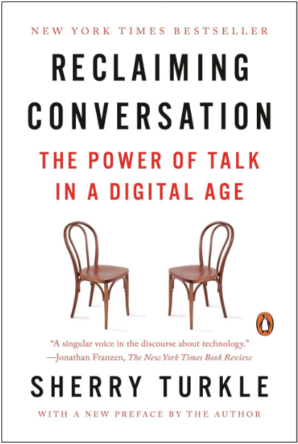 Book cover for Sherry Turkle's Reclaiming Conversation: The Power of Talk in a Digital Age, featuring two empty wooden chairs.