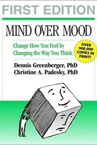 Book cover for "Mind Over Mood: Change How You Feel by Changing the Way You Think," first edition by Dennis Greenberger and Christine A. Padesky, PhD, featuring a cube illustration with two faces.