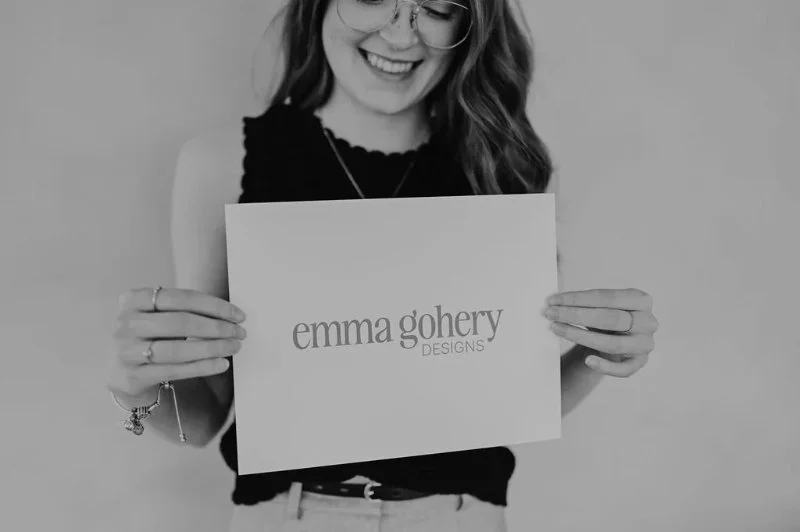 Black and white photo of Emma Gohery Designs logo representing branding and web design services.
