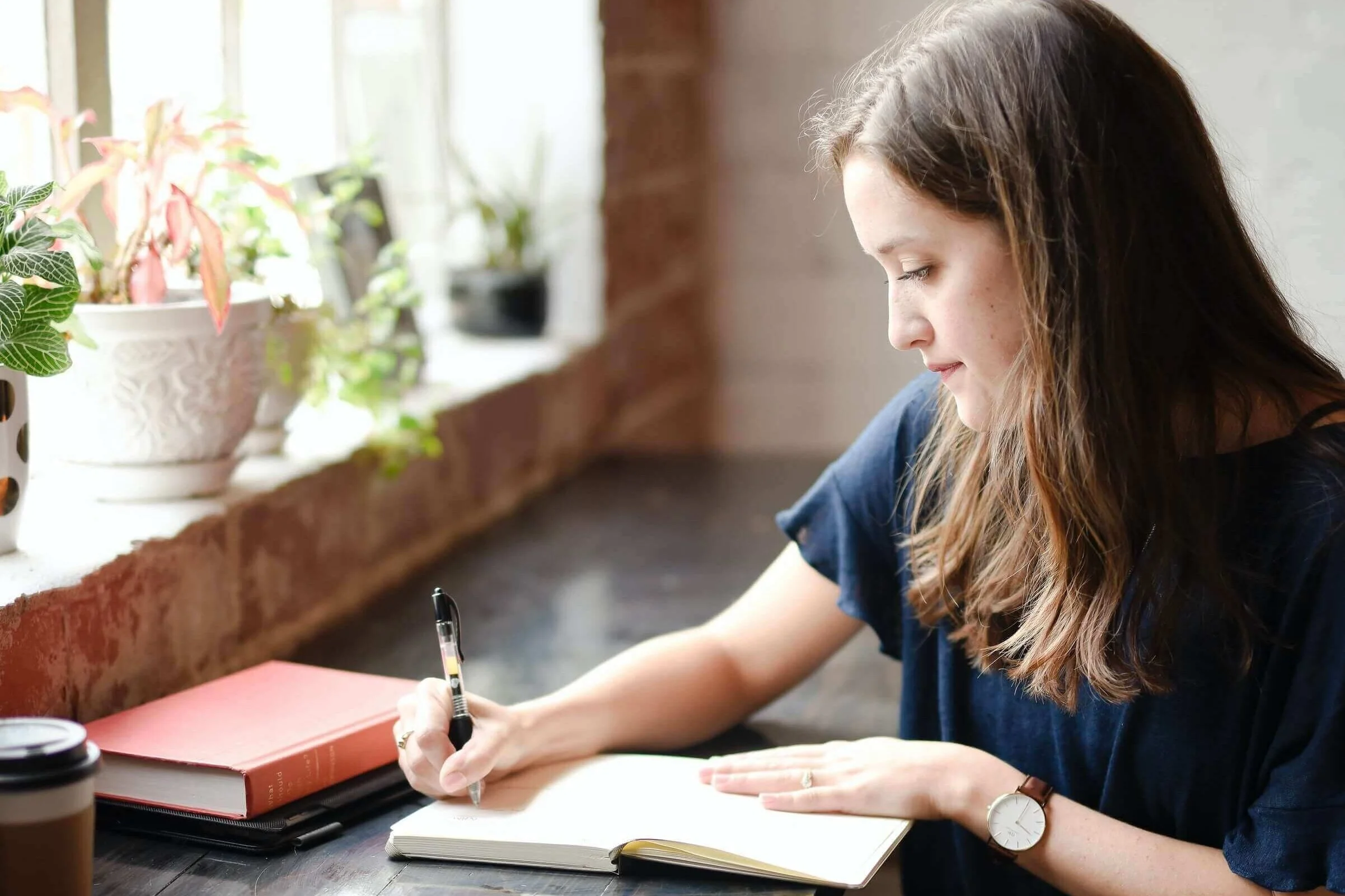 young-woman-writing-at-window.jpg