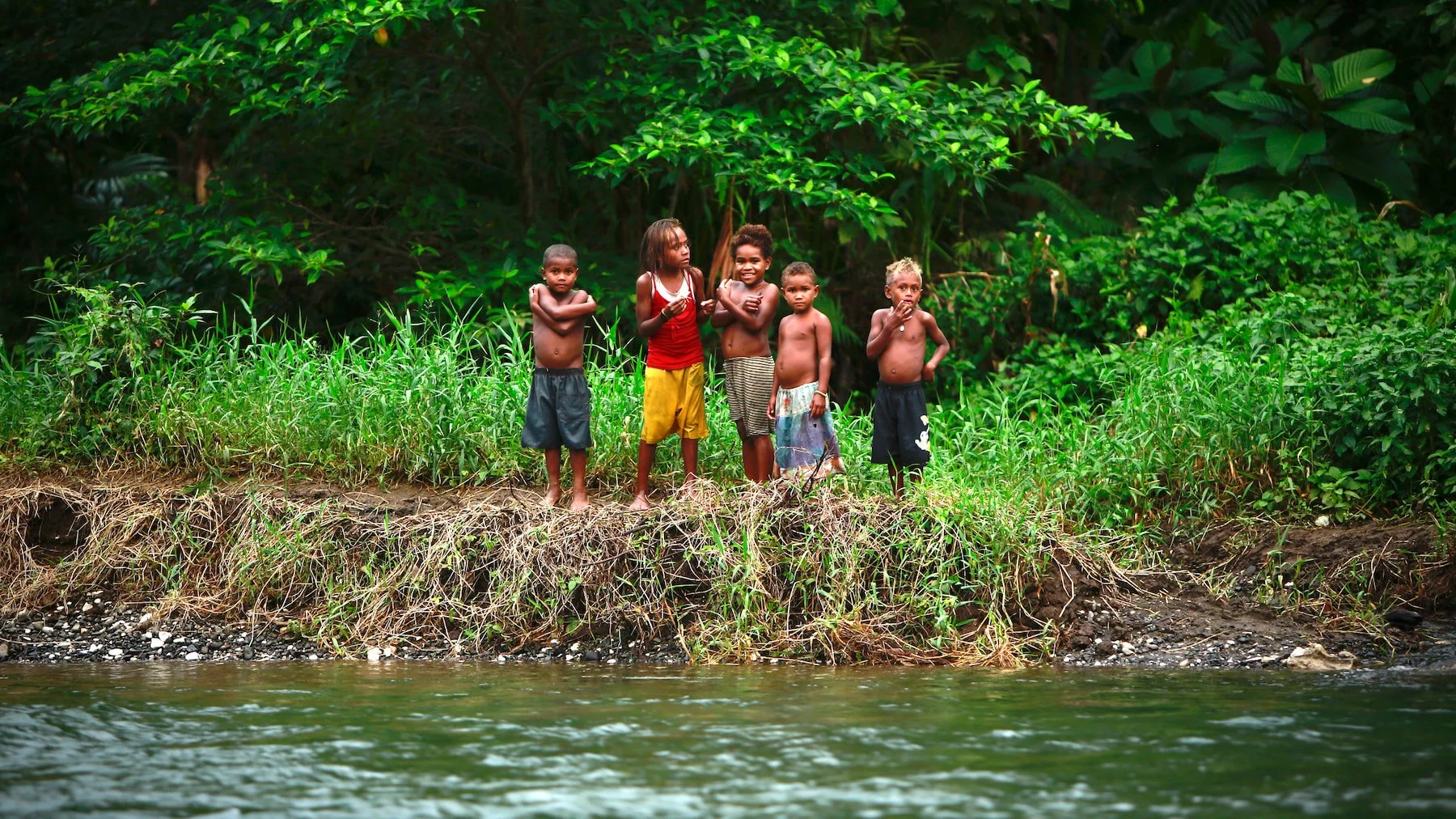 Baegu children by the banks of the Ataa River in the Solomon Islands.