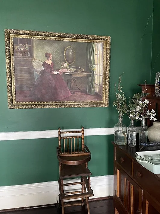 Building's Dining Room filled with paintings, antique furniture