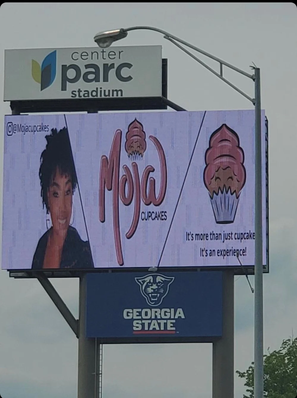 Mojo Cupcakes ad on a digital billboard at Georgia State's Center Parc Stadium in Atlanta