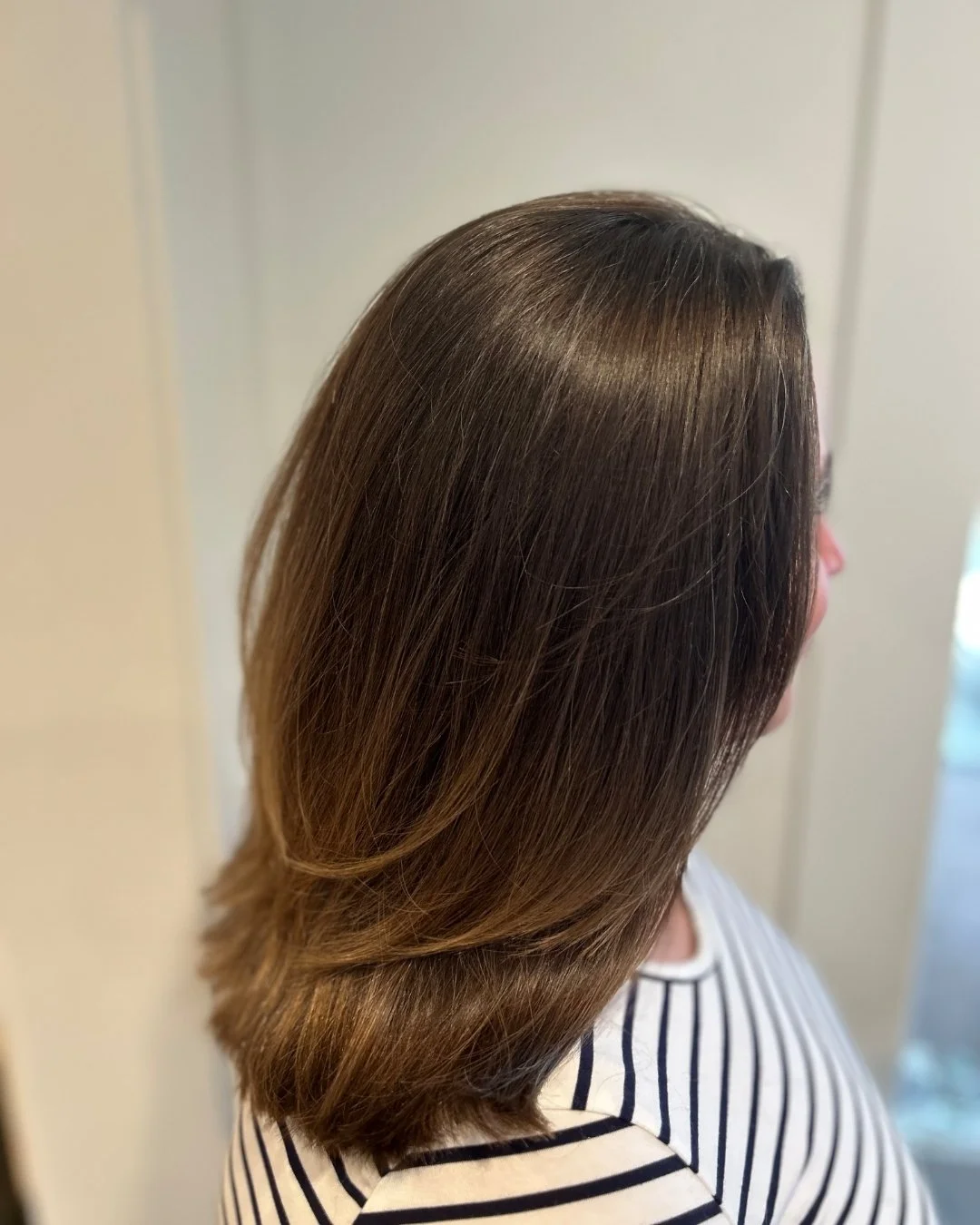 Before and After from one of our Top Stylists Christina! 
She says "This guest needed something fresh. She felt (literally) weighed down by all of that hair! We cut off over a foot, and glossed her up with Aveda Demi-permanent in warm shades to