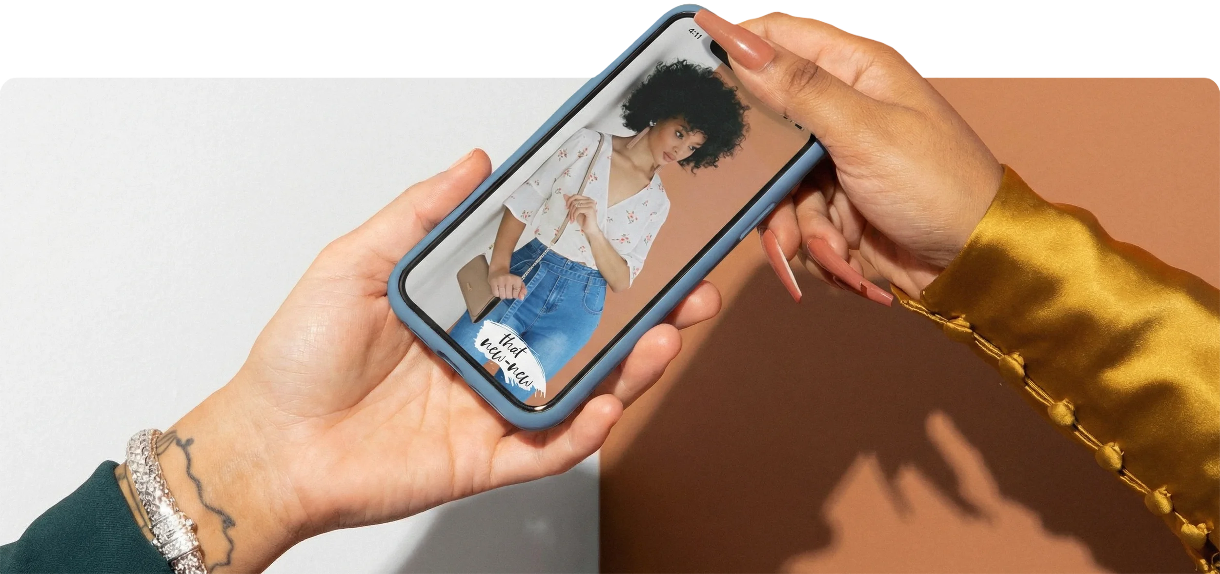 Windsor Fashions mobile shopping experience displayed on smartphone in hand.