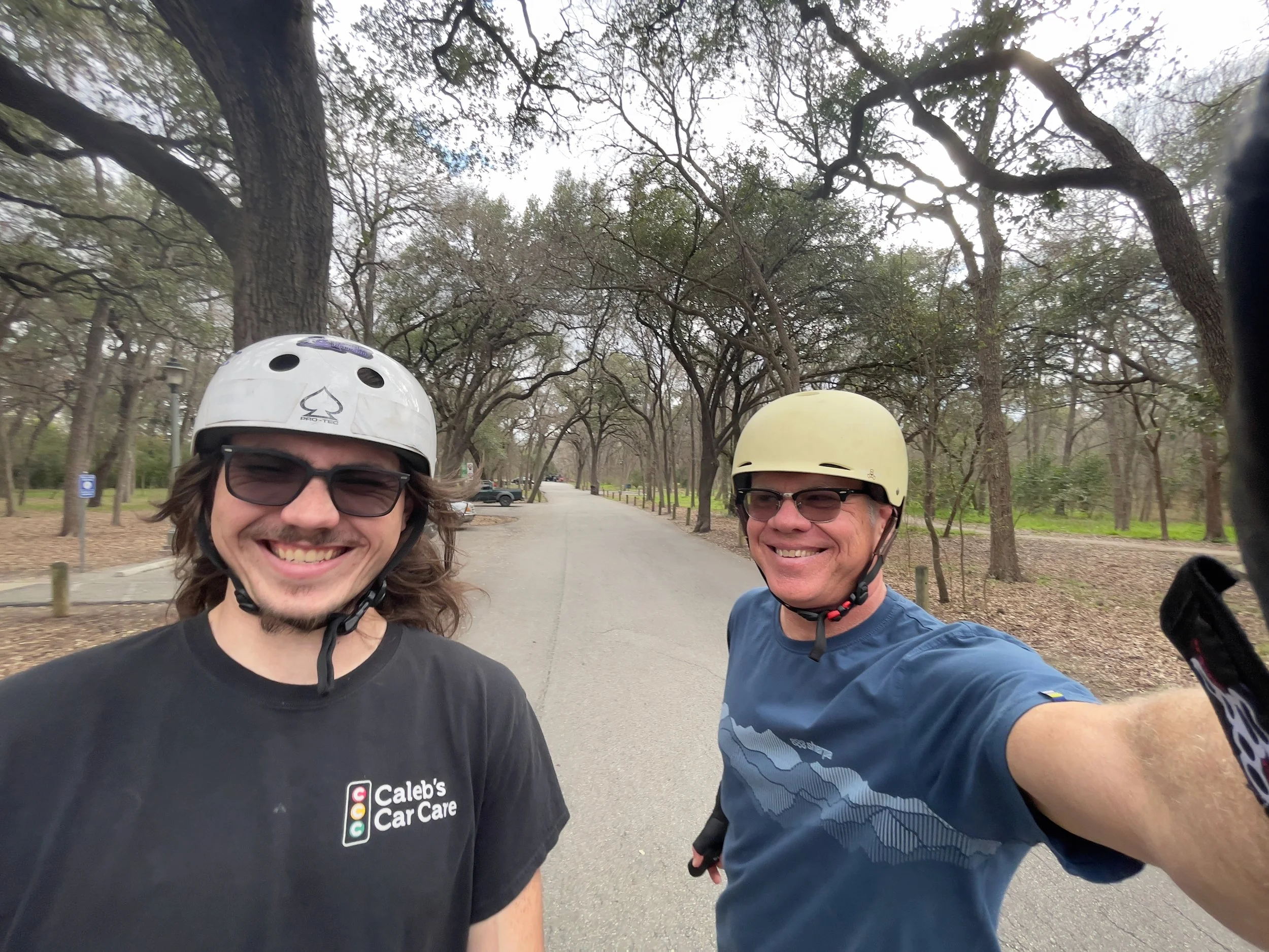 Out on electric skateboards in San Antonio, cracking up with my son Caleb