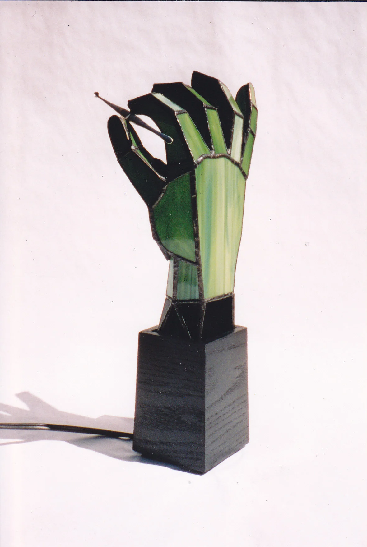 green_hand_table_lamp_with_scalpel_by_yourhero2-d4hdro0.jpg
