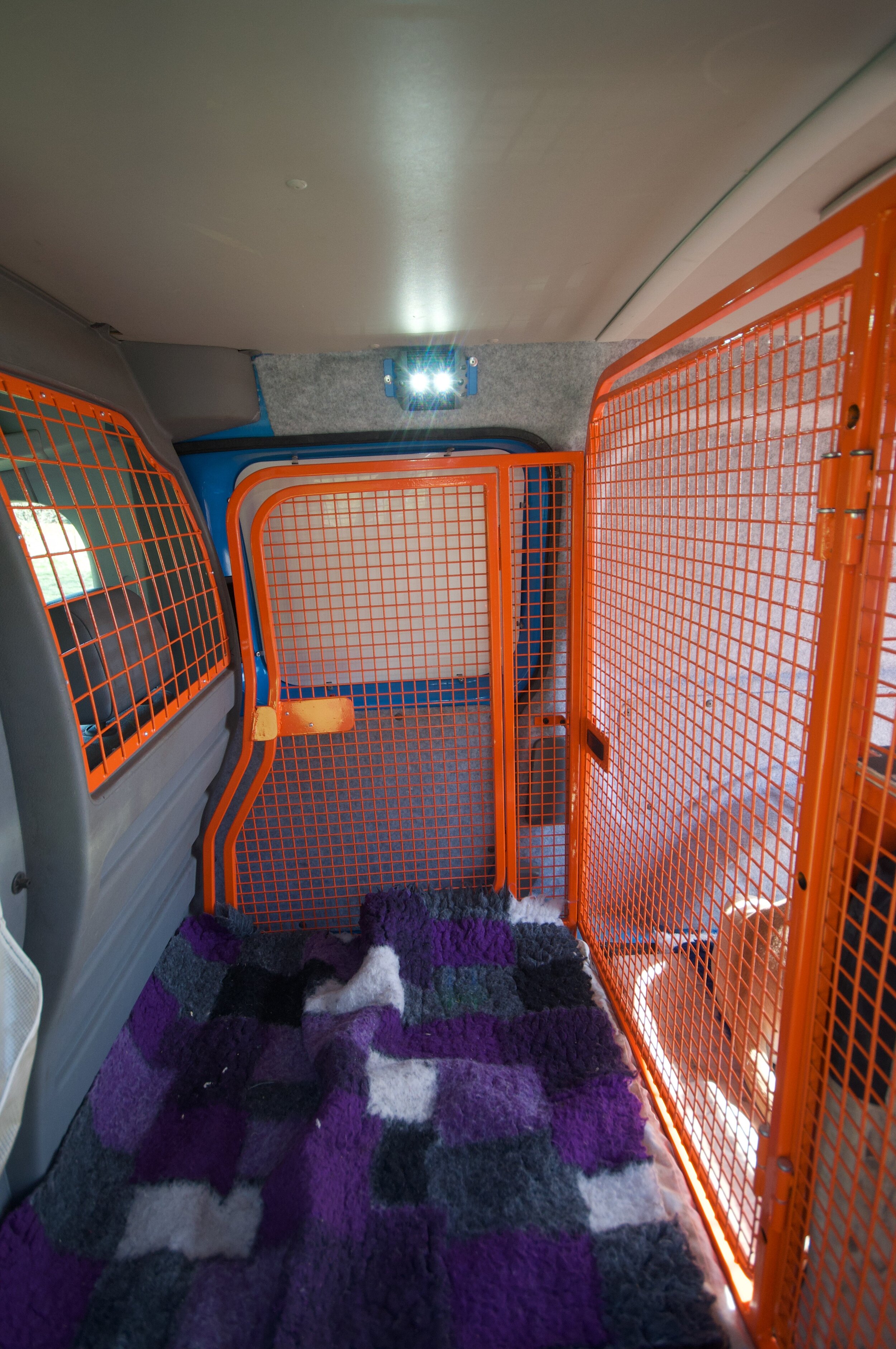 Front cage with the door allowing the van door to be left open for ventilation