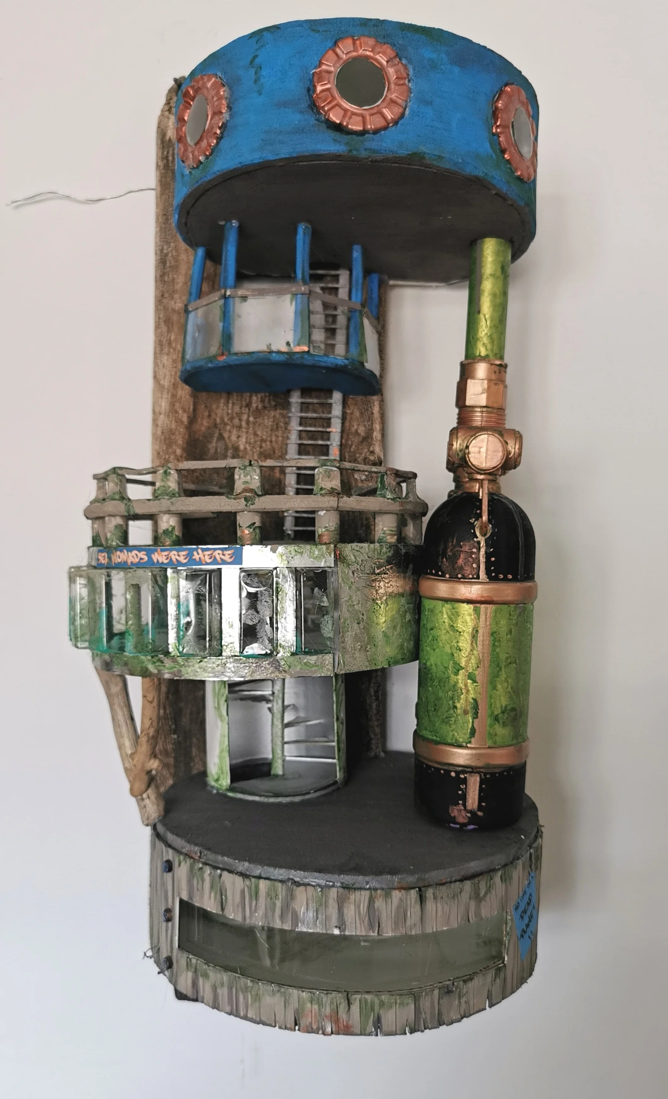 'How we live now 2126' explores miniature worlds 100 years from now when the rising waters and melting ice caps have made living on land impossible, instead people have constructed floating homes or homes that cling to cliffs or rock outcrops. Each p