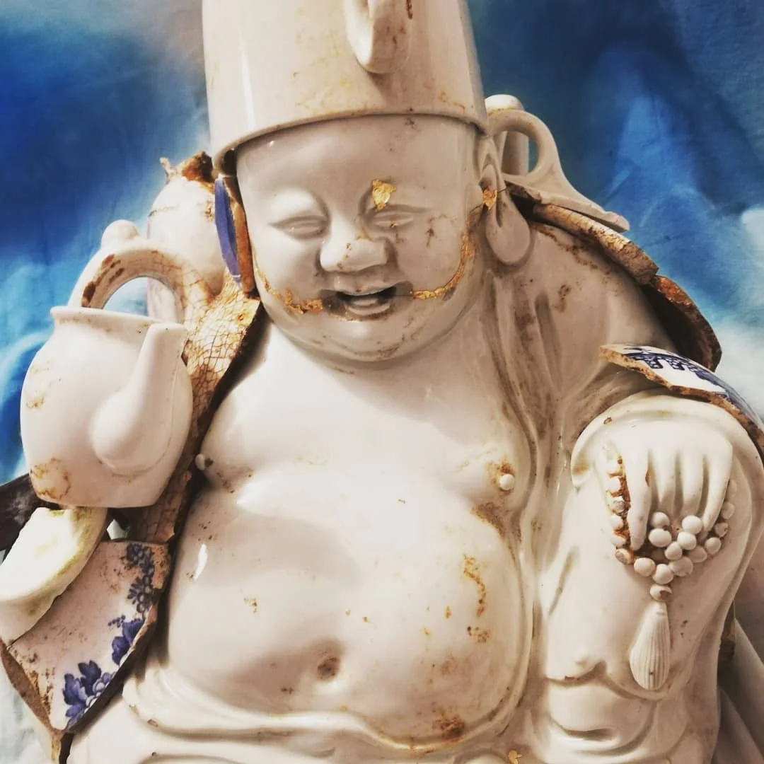 'Protective Spirits' Many countries have these spirits to protect against the dark. Clay, collage, marine plastic.
Image: The Buddha of Broken things. Found broken antiques ceramic pieces, cotton cushion, the protector of all who mend. 2021