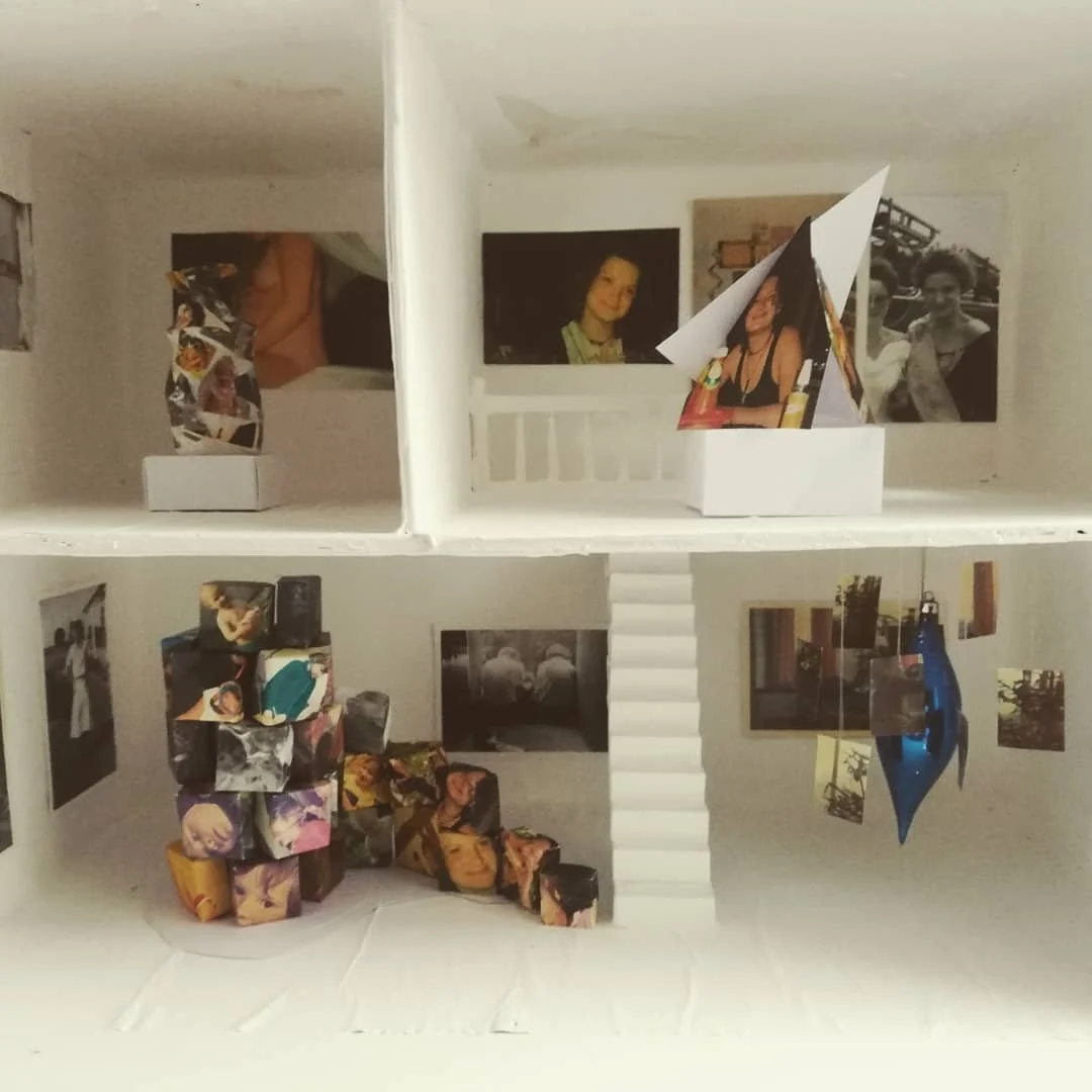 'Weaving Migrants' A year long research into the artists ancestors, from ancient royalty  to the Huguenot weavers. 
Image: Dollhouse White Cube. A miniature lockdown gallery space containing old family photos and treasured objects. 2020