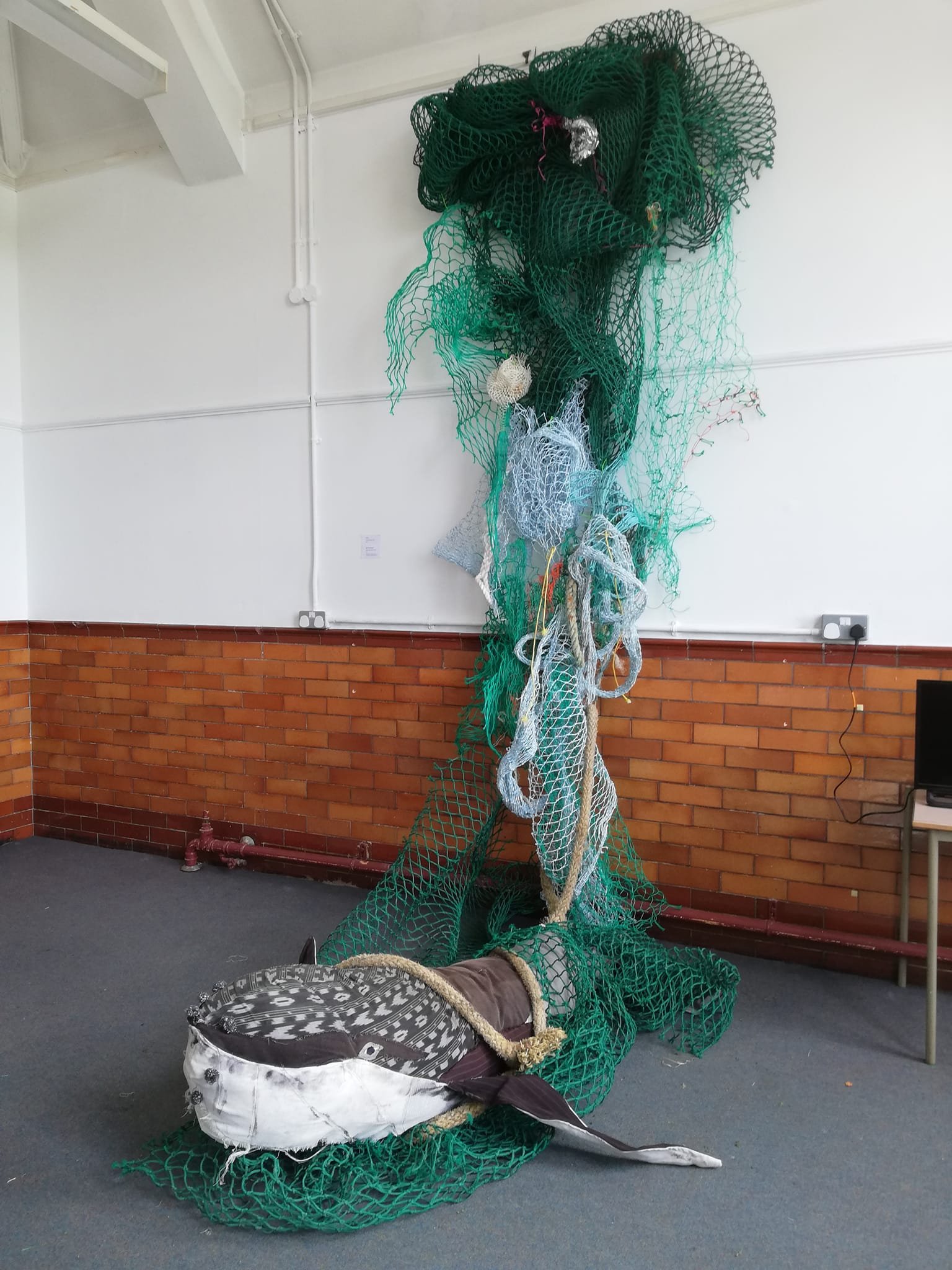 PROTEST' A series of works that comment on the artists activist streak. 
Image: Jeff the Whale. recycled fabric, fishing net, found object. Originally created in 2018, Jeff was made to become a 'Jesus' figure, a benign entity who ended up being cruci