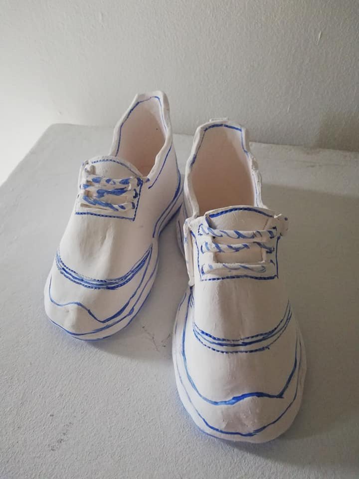 'Weaving Migrants' A year long research into the artists ancestors, from ancient royalty  to the Huguenot weavers. 
Image: Labels. Still from a short film projected onto moving porcelain labels containing the names of family members, Huguenot descend