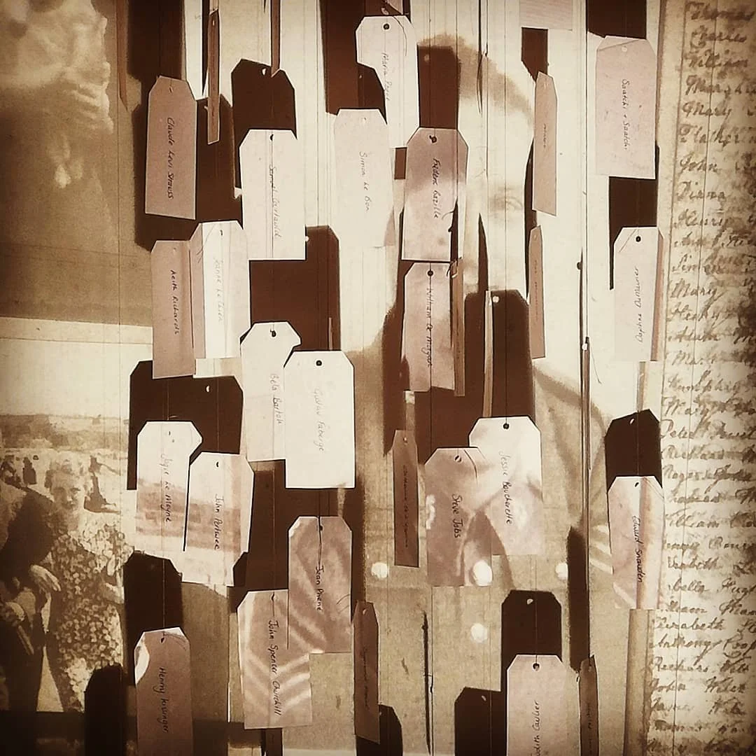 'Weaving Migrants' A year long research into the artists ancestors, from ancient royalty  to the Huguenot weavers. 
Image: Labels. Still from a short film projected onto moving porcelain labels containing the names of family members, Huguenot descend