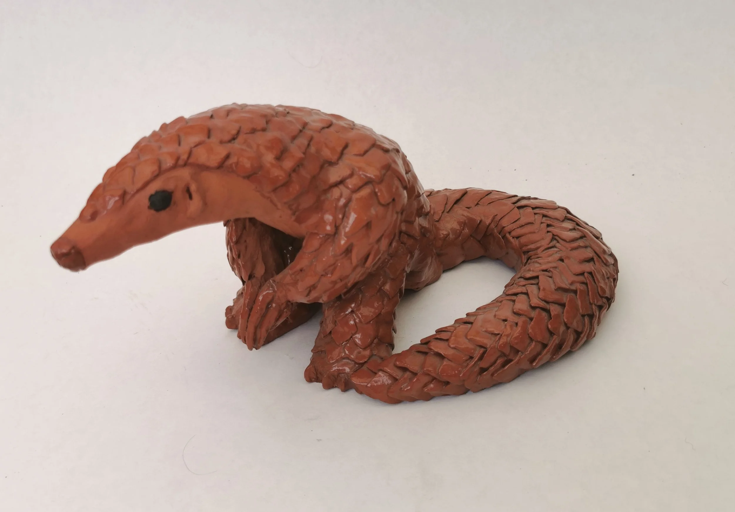 'Protective Spirits' Many countries have these spirits to protect against the dark. Clay, collage, marine plastic. Image: Pangolin of protection, created during the Covid outbreak when these creatures were believed to have been the cause, thus reduci