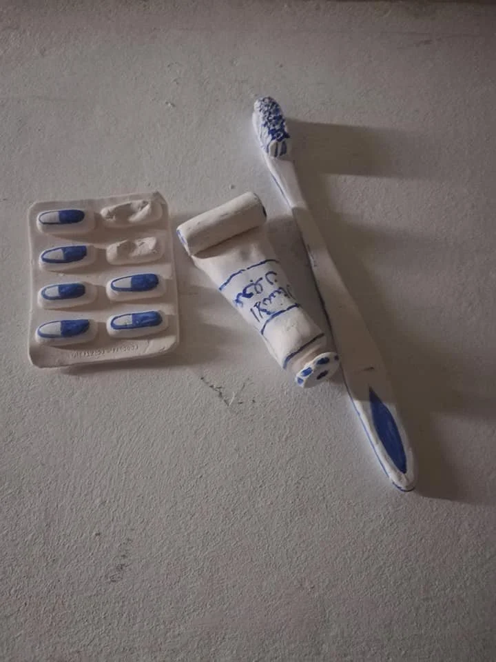 'Weaving Migrants' A year long research into the artists ancestors, from ancient royalty  to the Huguenot weavers. 
Image: Labels. Still from a short film projected onto moving porcelain labels containing the names of family members, Huguenot descend