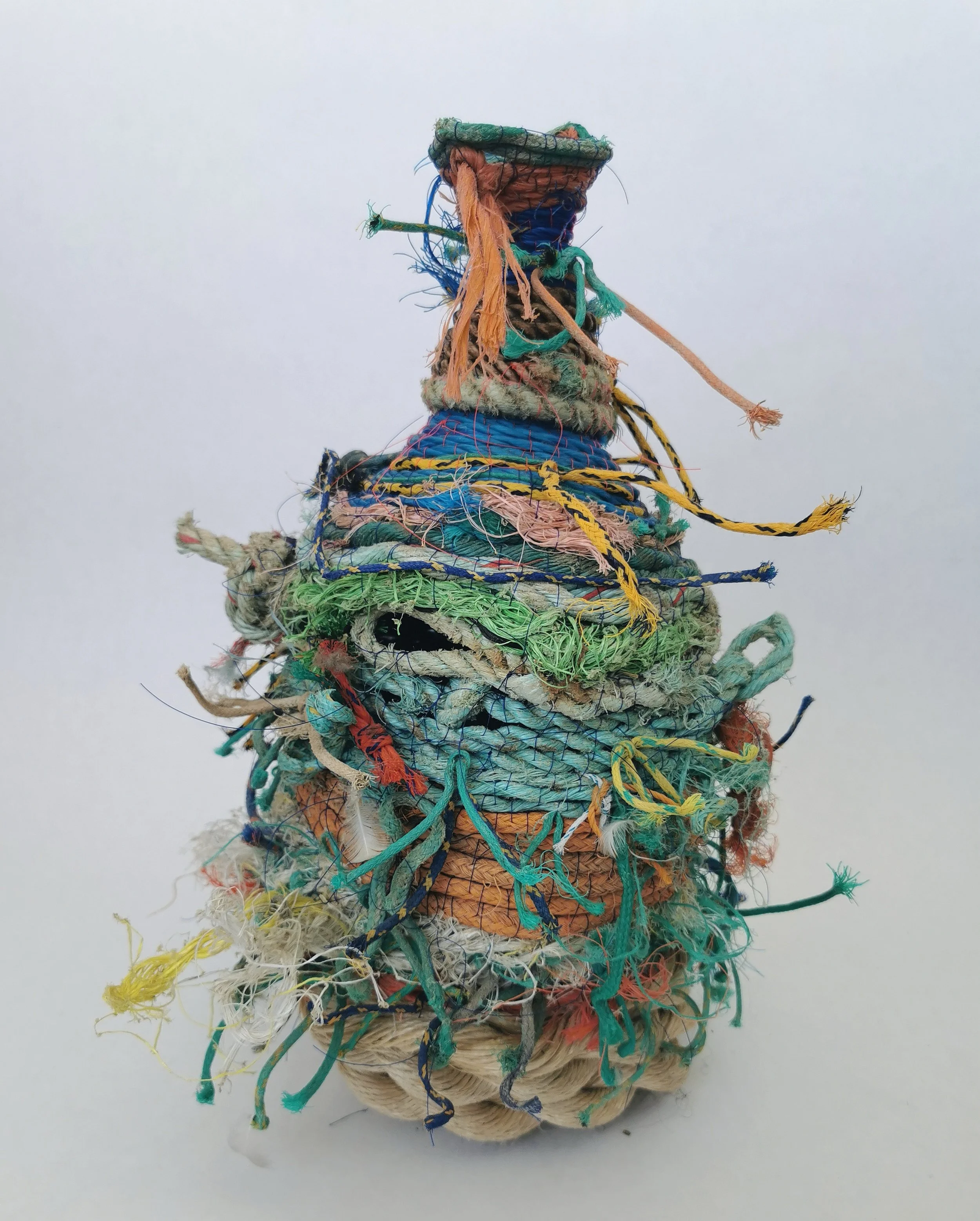 'Ocean Going Vessels' are a series of vases and jugs created entirely from found rope and other flotsam and jetsam found near the artists home and internationally. 