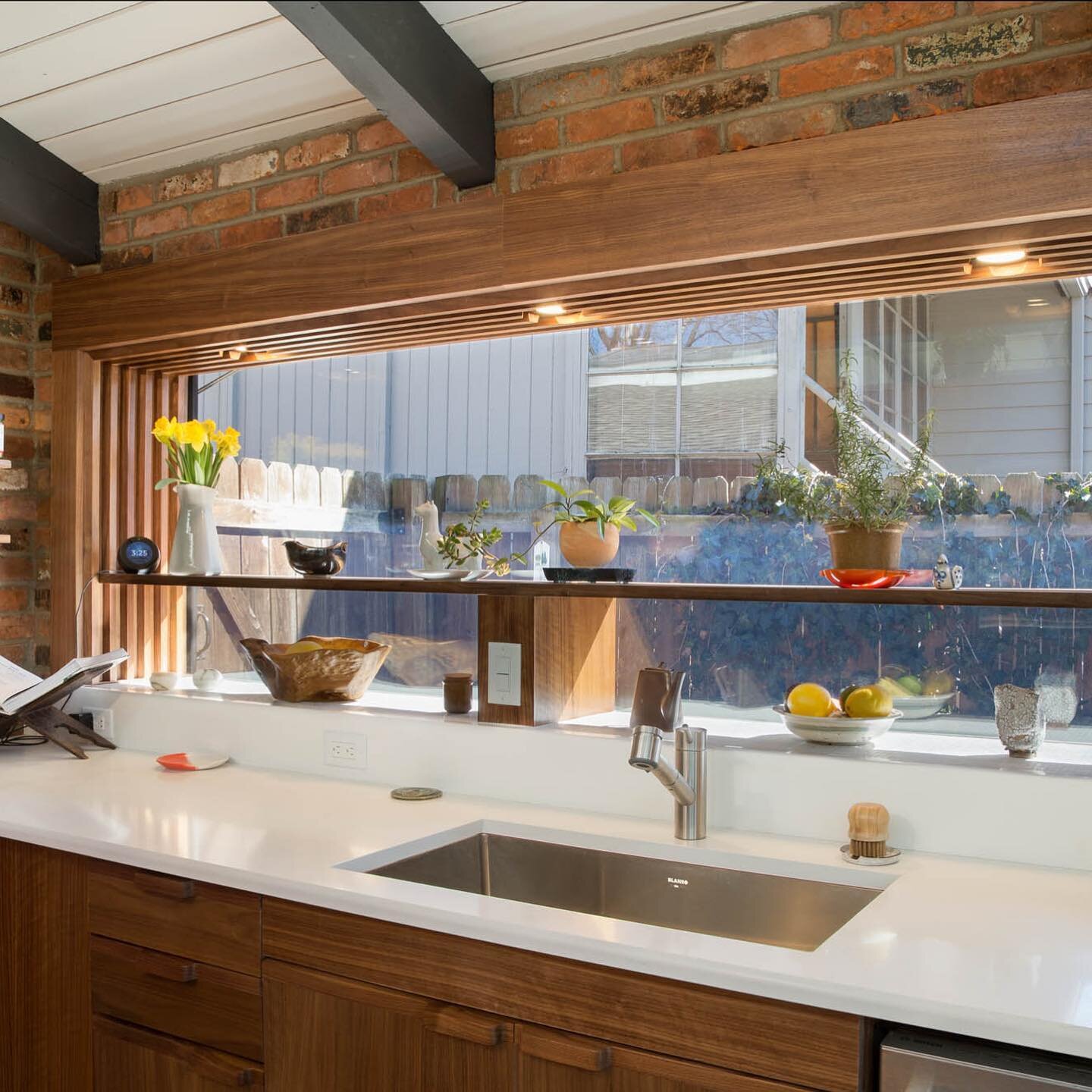 This custom picture window is another favorite at our #midcenturymodern remodel project! We strived to keep with some of the original kitchen design details while updating all the cabinetry and surfaces. Removing the dated glass block and slider wind