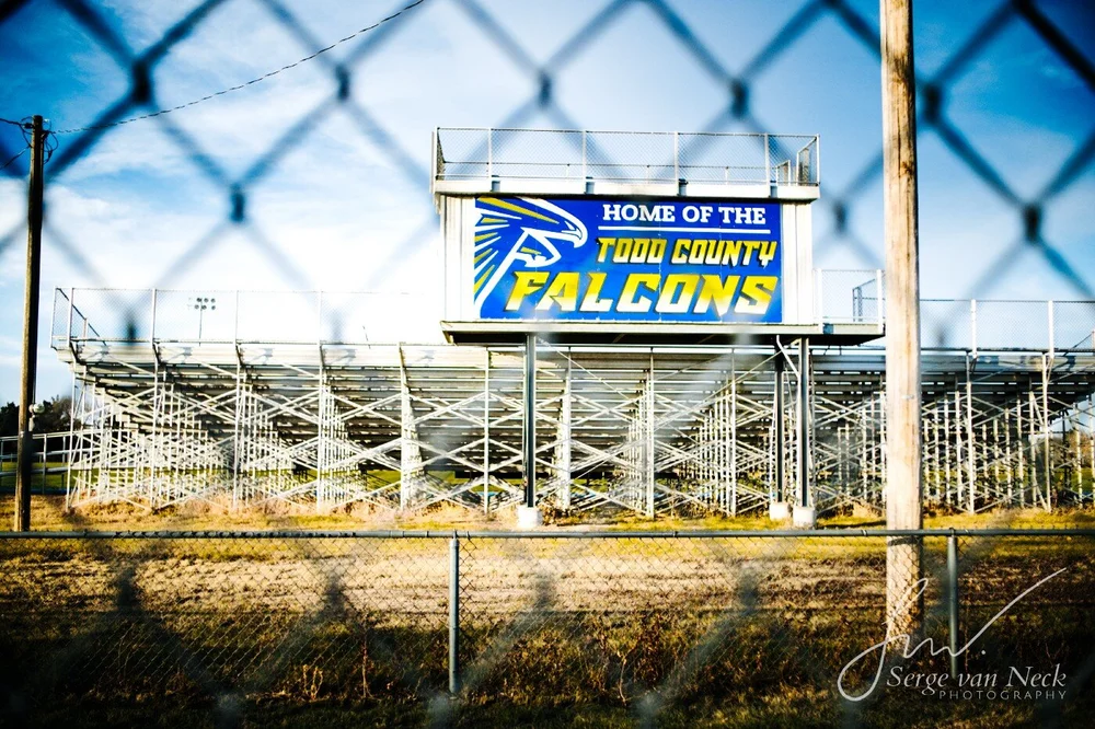 Bleachers taken through a fence