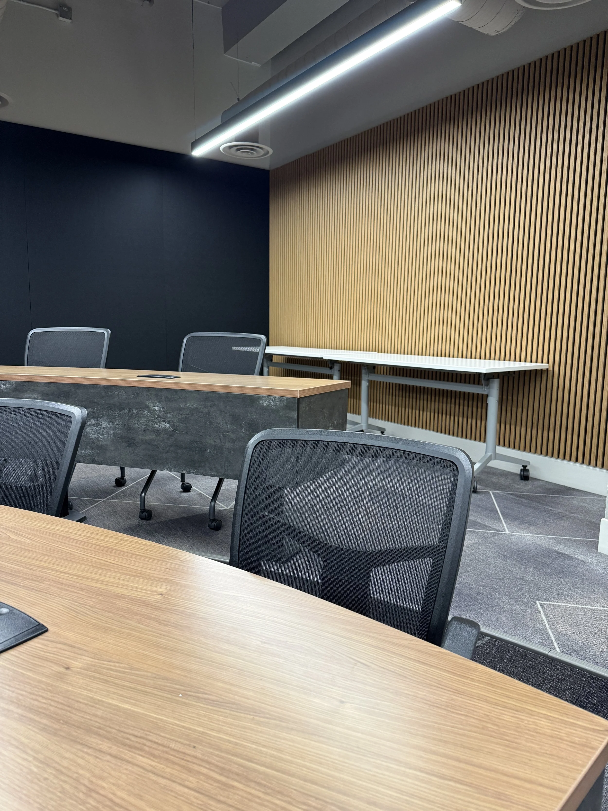 Sound proofing done in classroom / training room done with acoustical felt and wood slats in Calgary, AB