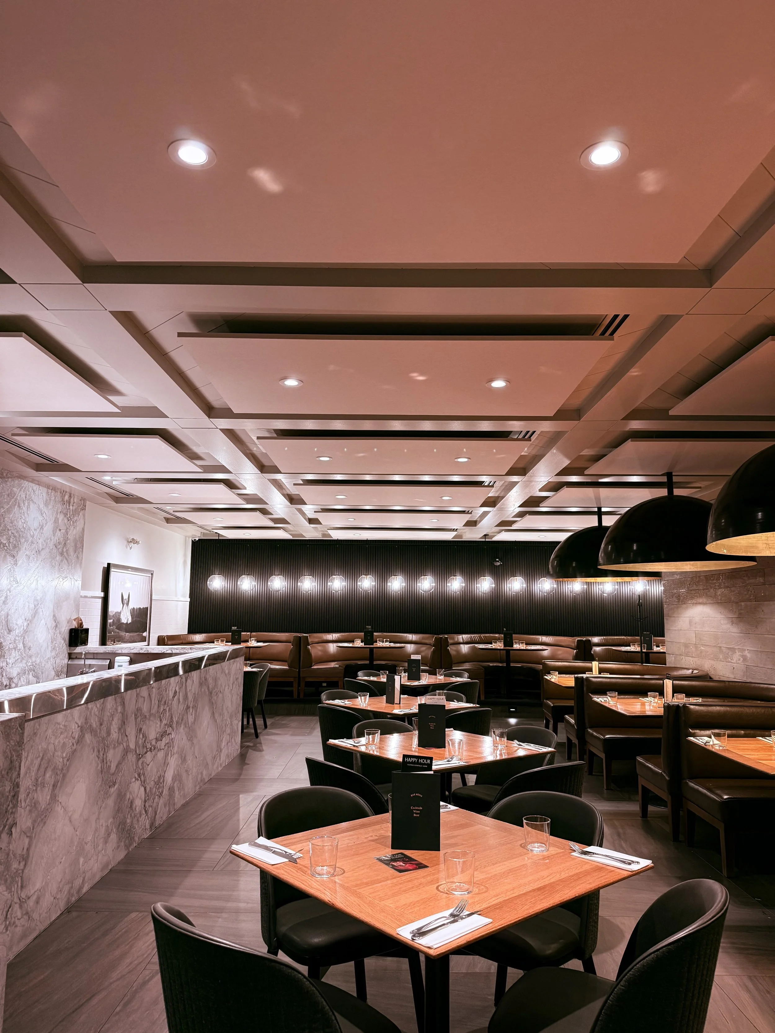 Sound proofing and acoustic treatment done in Earls restaurant in Calgary, AB using cloud panels and acoustic wood slats
