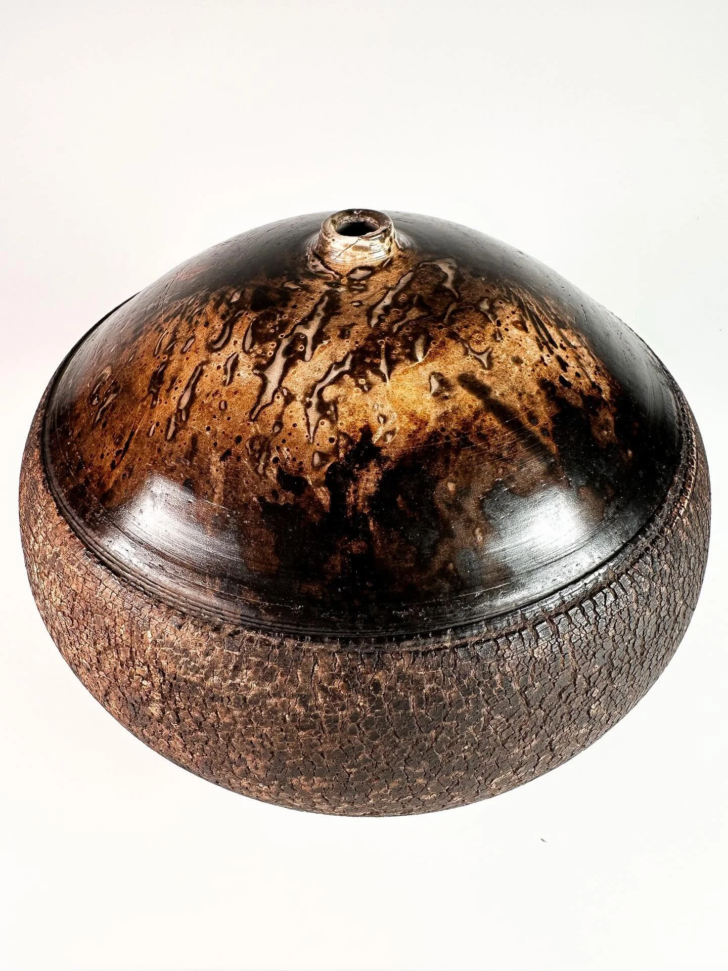 One of my favorite pieces from the last obvara Raku firing! I really thought I exposed it to the solution for too long and would risk losing interesting detailing in the piece but I was so happily wrong! The yeasty pattern on the top is just so satis