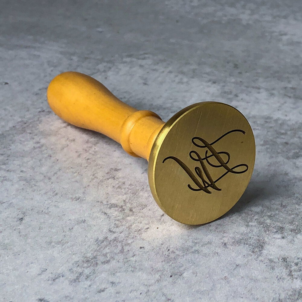 TypeAInvitations_DesignAndLetterpressStudio_CustomMonogram_WaxSeal-3Stamper.jpeg
