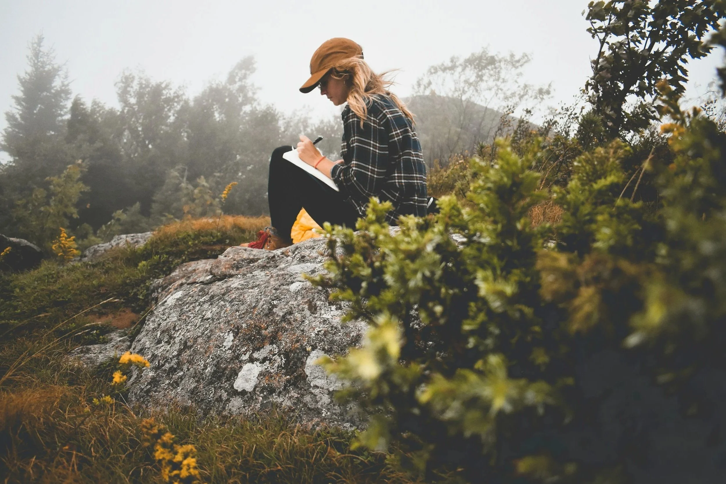 woman journaling in nature