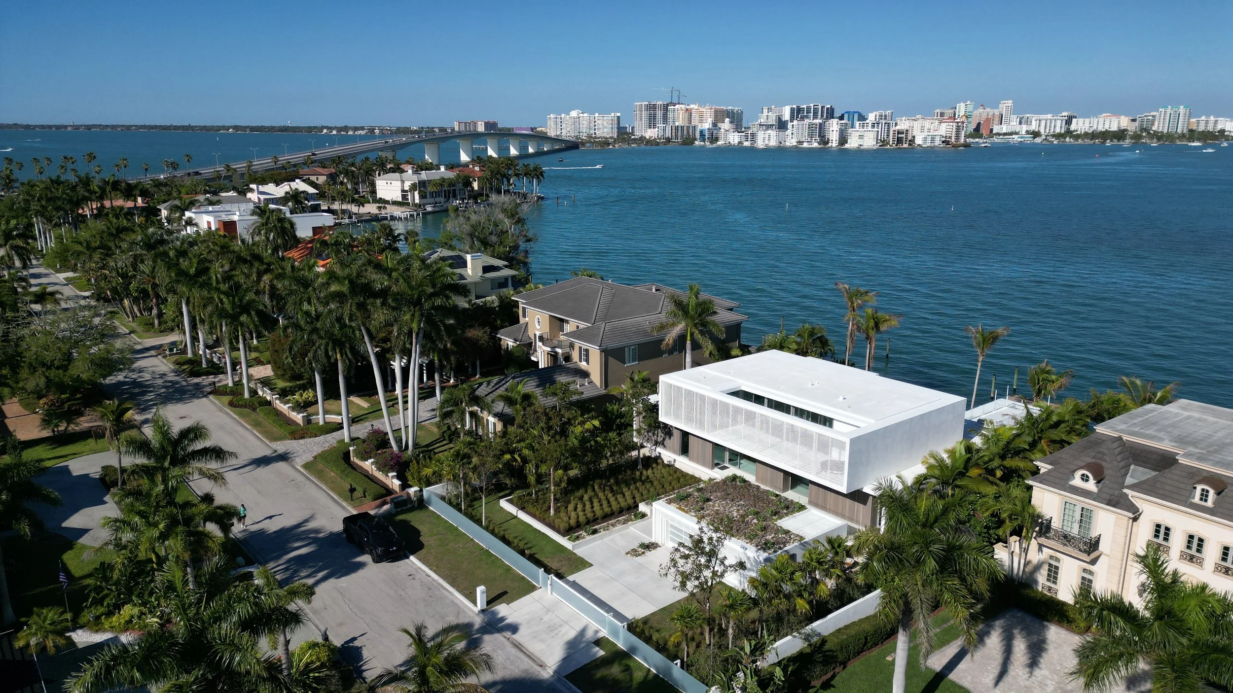 Equa on Bird Key designed by Hive Architects as an all concrete pile supported structure on an elevated plinth to maximize coastal resiliency and prevent flooding