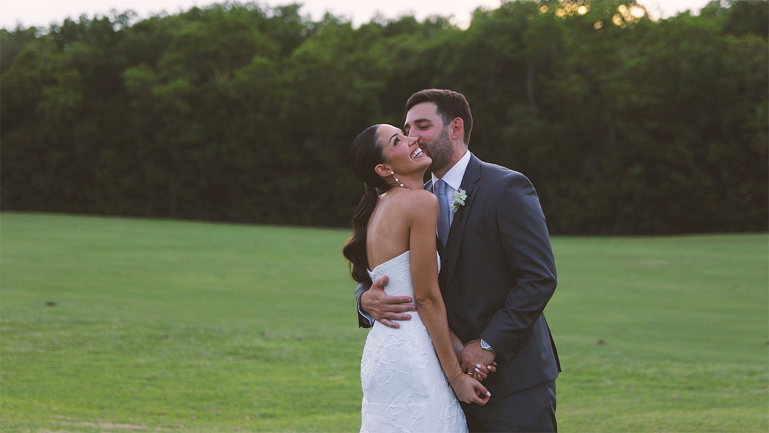 Bride and groom together on the Crandon Golf fairway at sunset